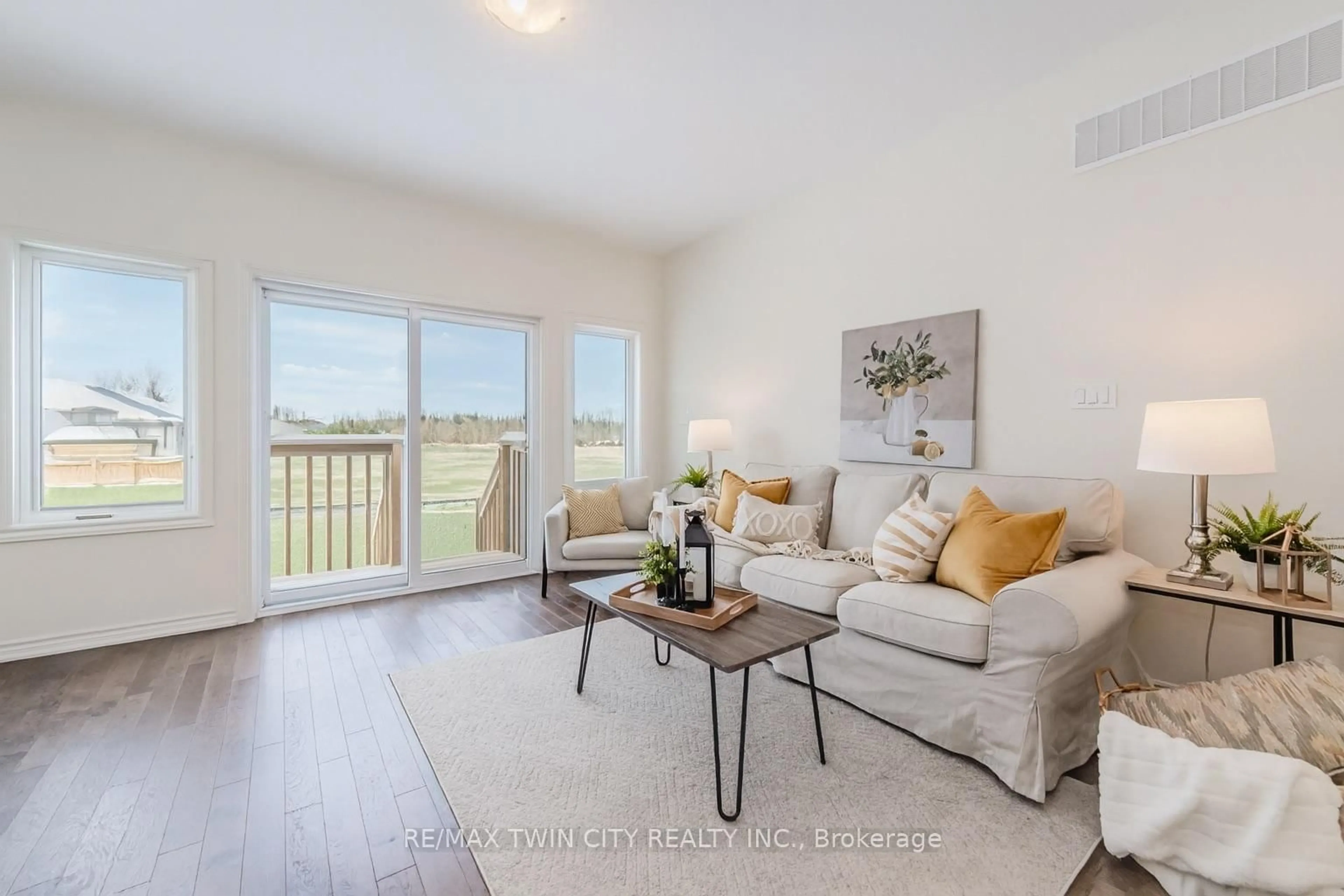 Living room with furniture, wood/laminate floor for 104 Cheryl Ave, North Perth Ontario N0G 1B0