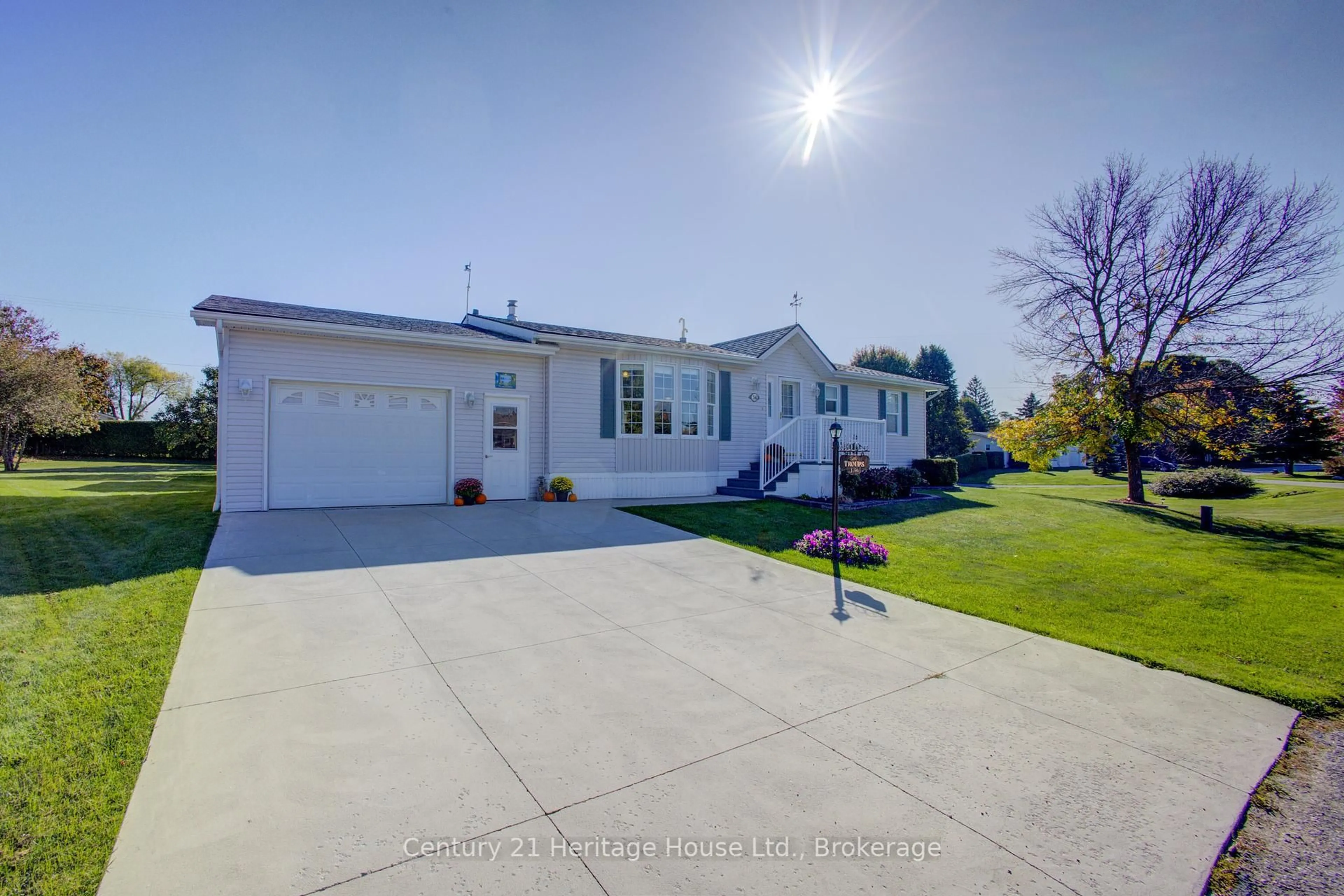 A pic from outside/outdoor area/front of a property/back of a property/a pic from drone, street for 56-6612 Minto Line 12 Rd, Minto Ontario N0G 1M0