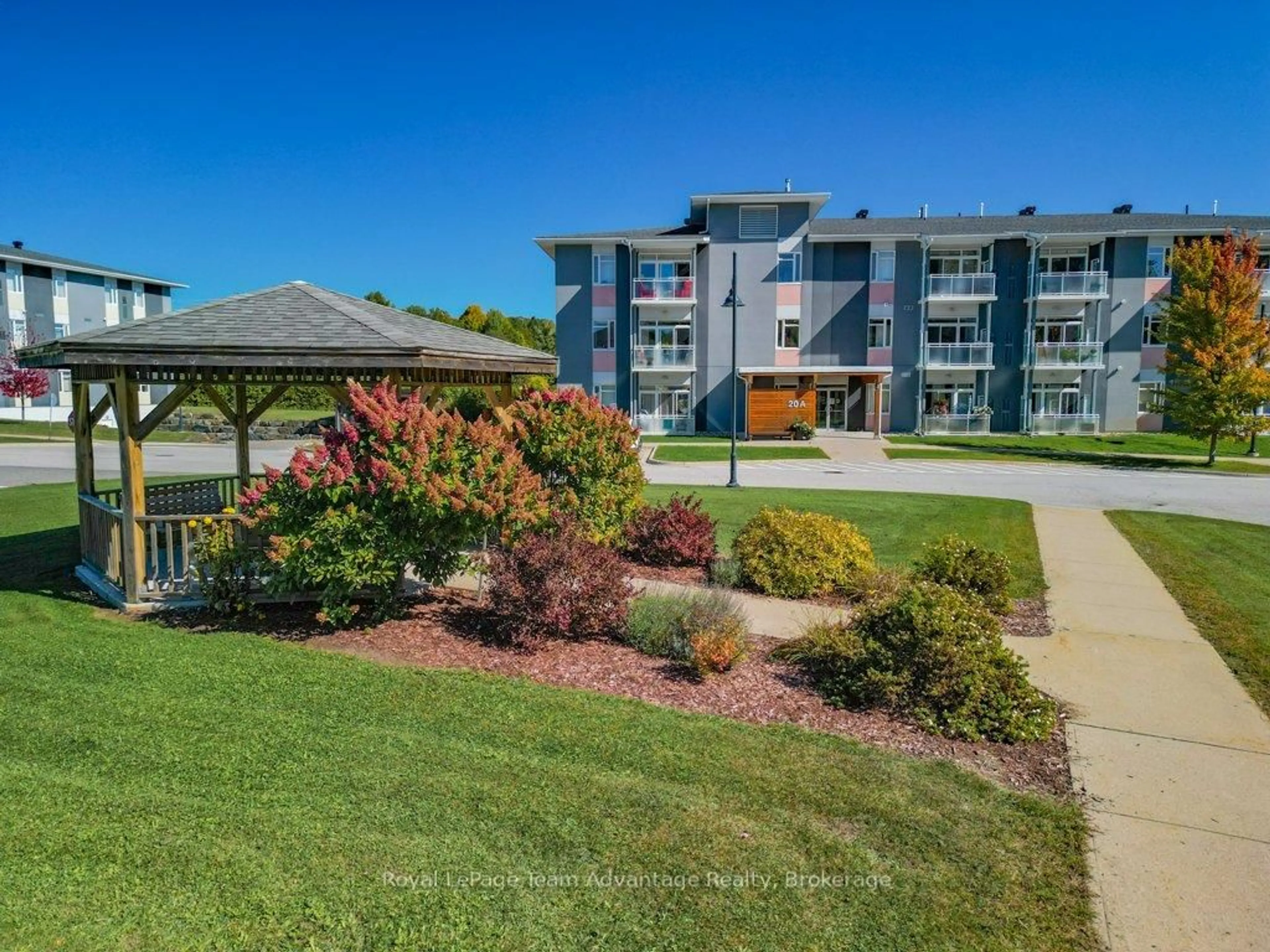 A pic from outside/outdoor area/front of a property/back of a property/a pic from drone, unknown for 20A Silver Birch Crt #203, Parry Sound Ontario P2A 0A7