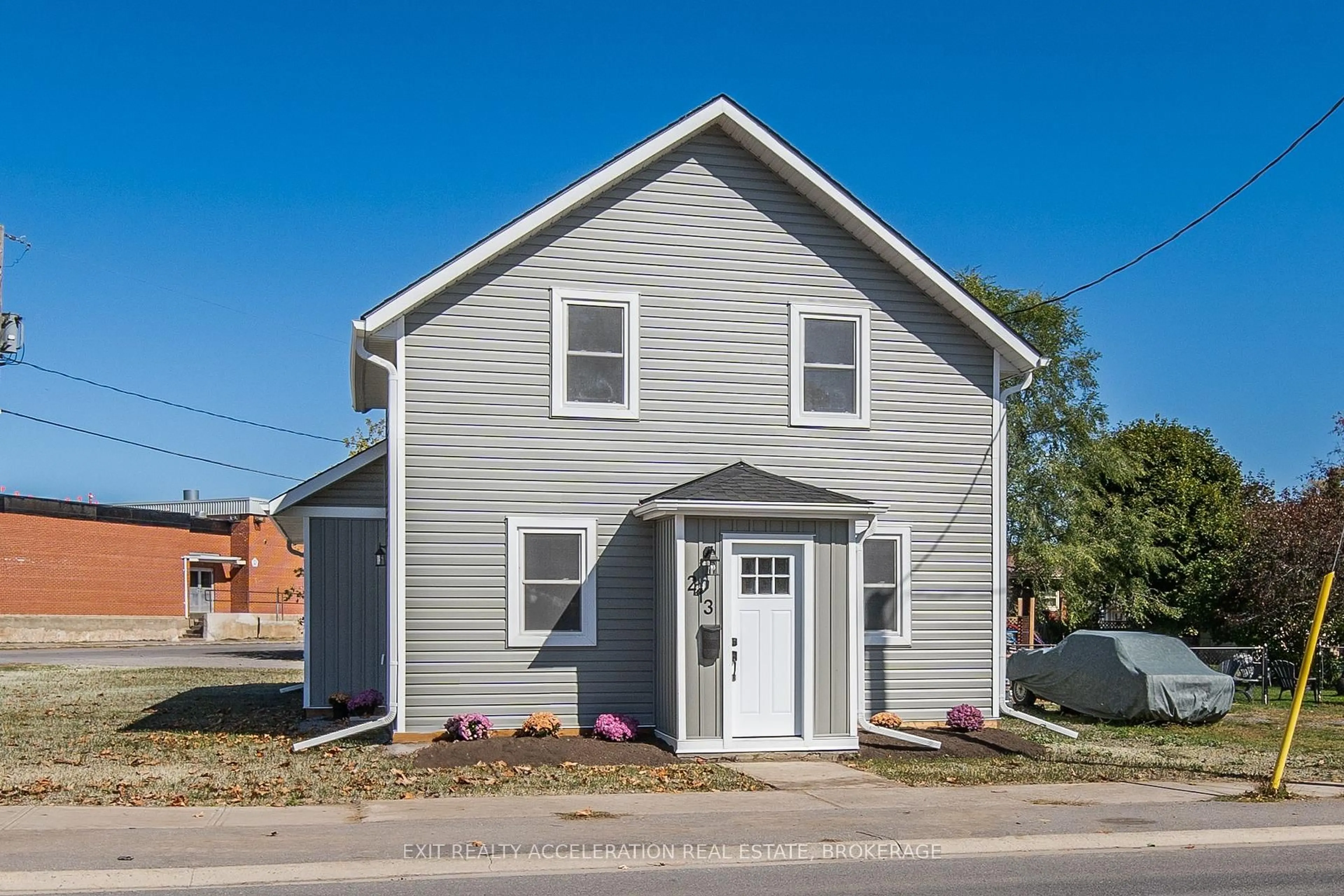 Home with vinyl exterior material, street for 213 Belleville Rd, Greater Napanee Ontario K7R 2R4
