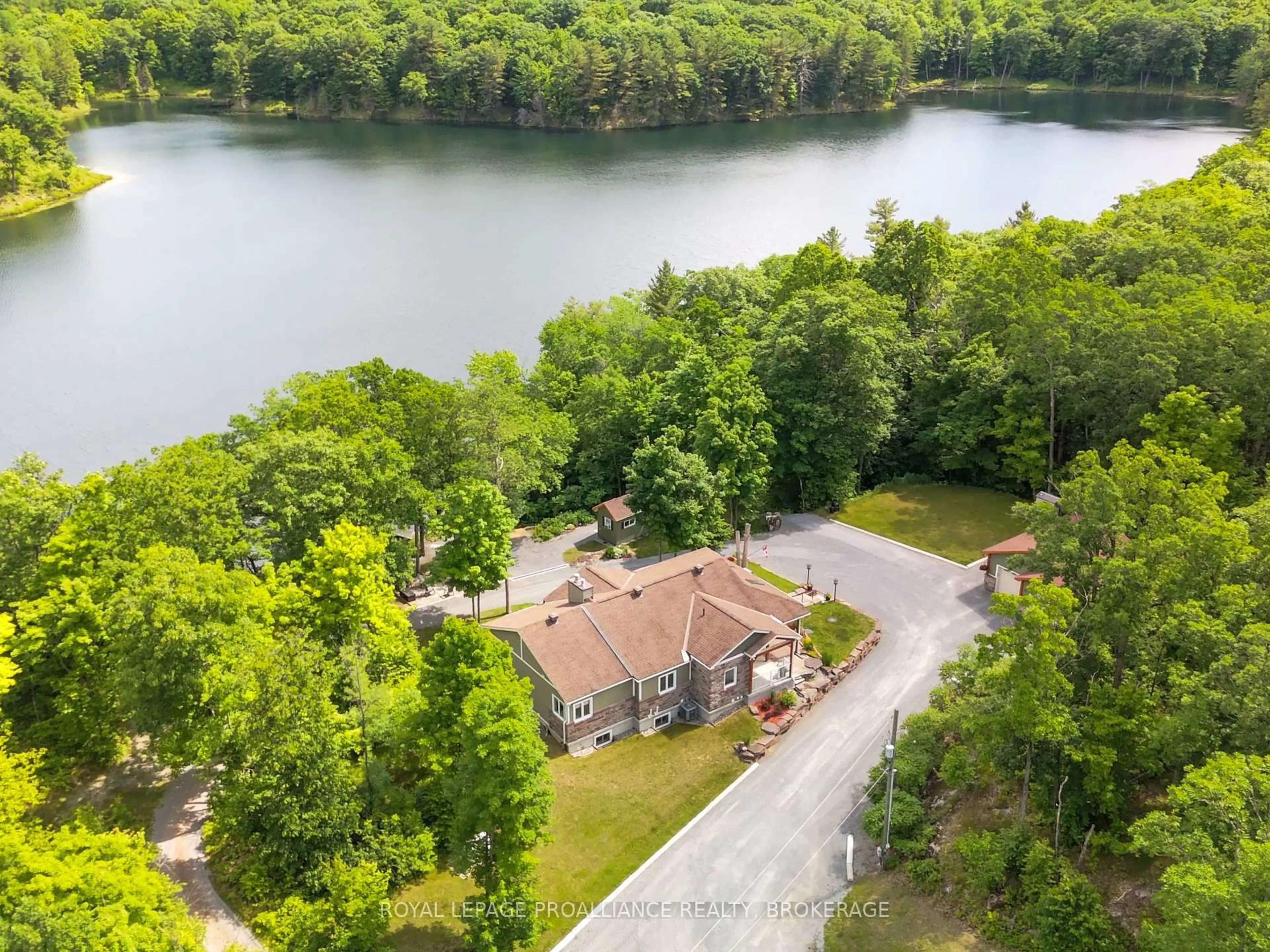 A pic from outside/outdoor area/front of a property/back of a property/a pic from drone, water/lake/river/ocean view for 3670B Westport Rd, Godfrey Ontario K0H 1T0