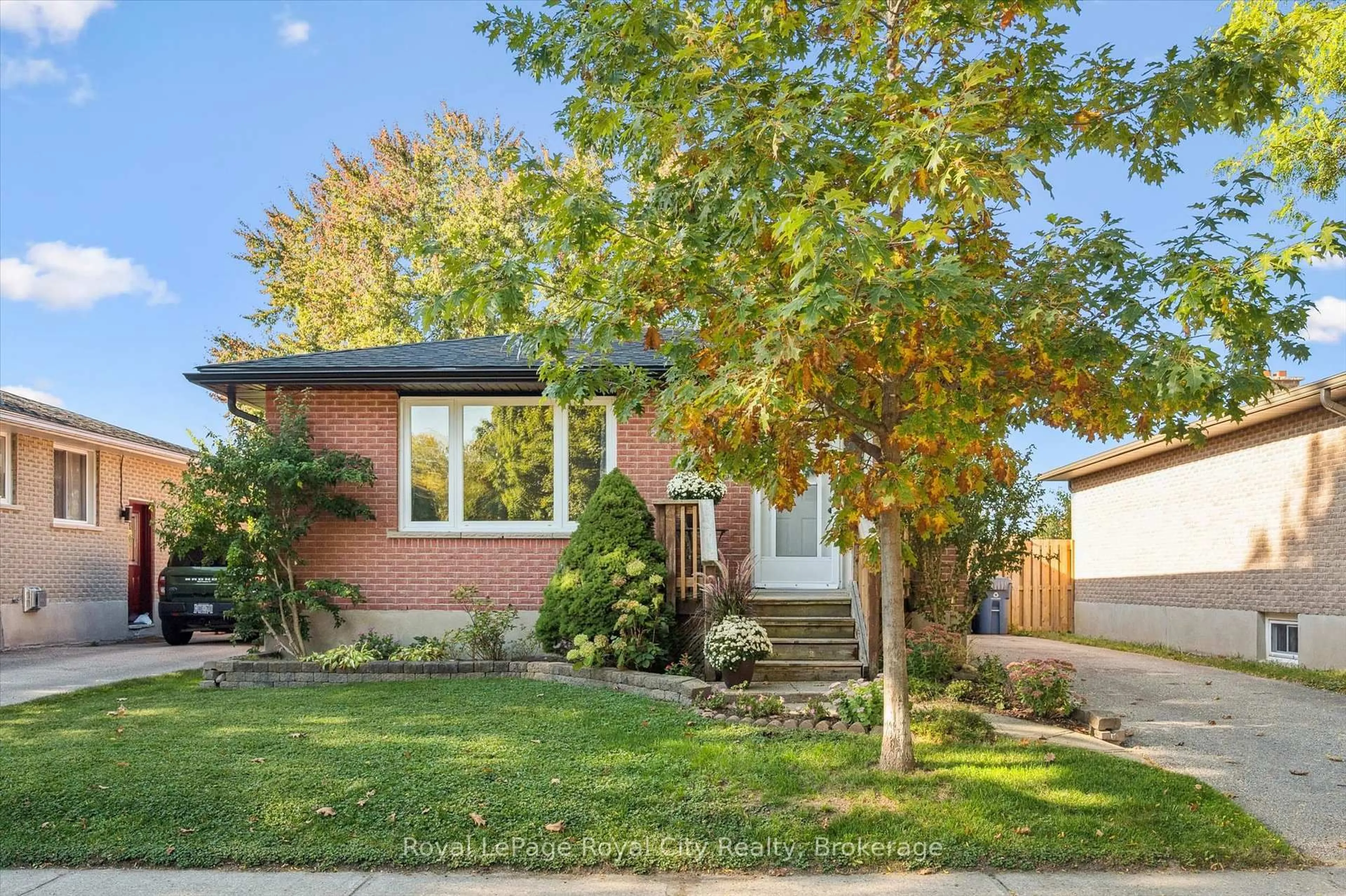 Home with brick exterior material, street for 165 Hadati Rd, Guelph Ontario N1E 6N3