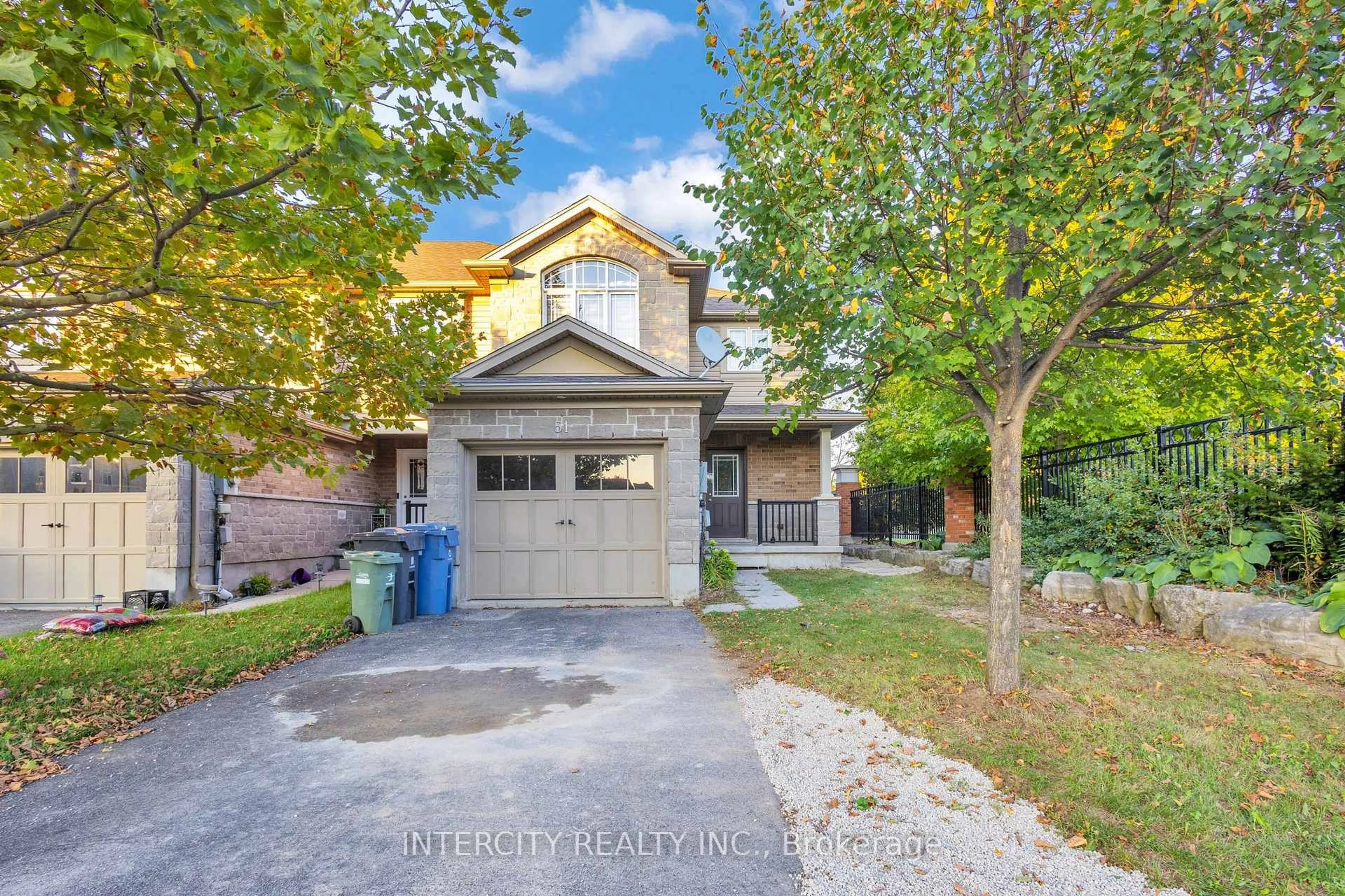 Home with brick exterior material, street for 51 Laughland Lane, Guelph Ontario N1L 0C9