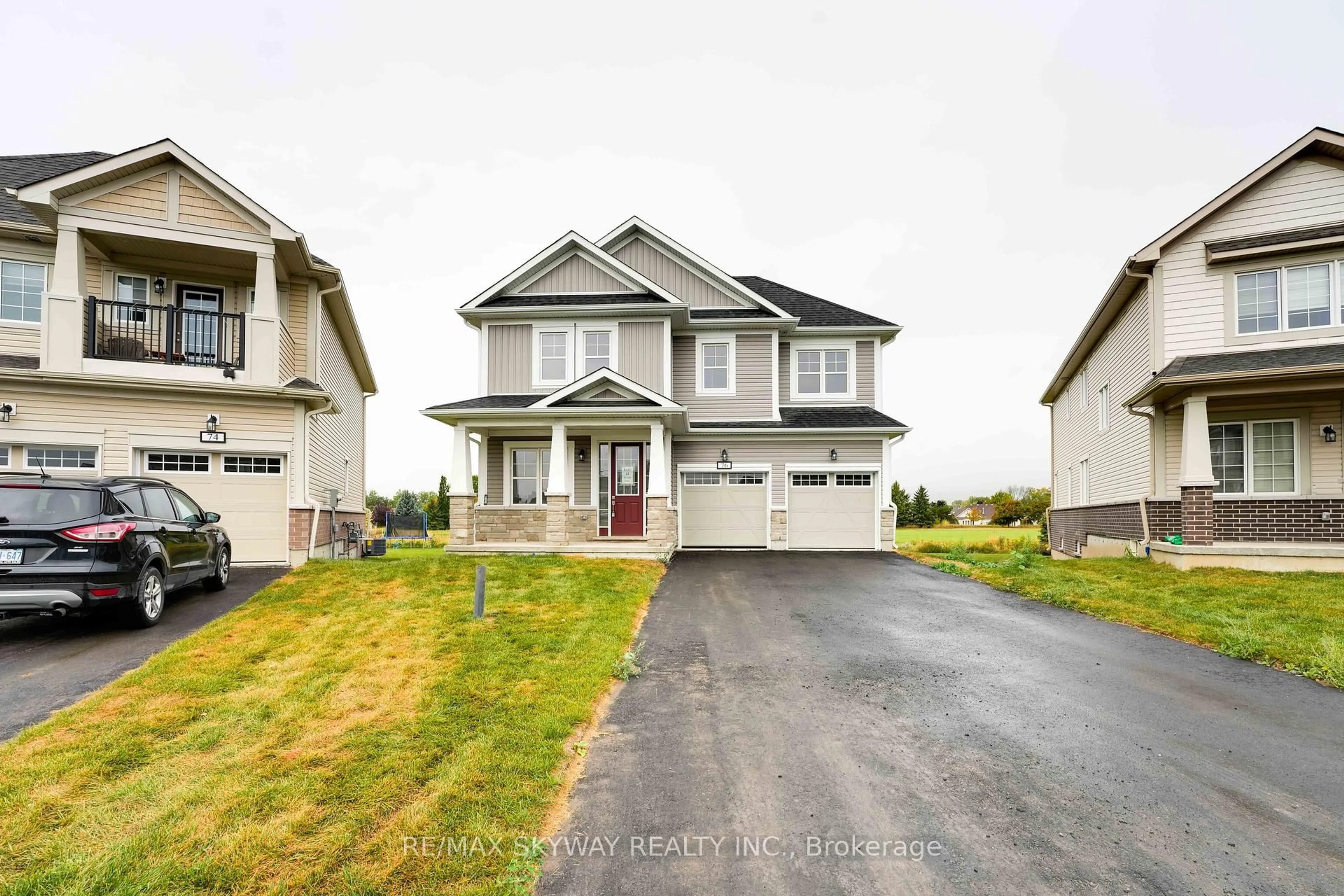 Home with vinyl exterior material, street for 76 Golf Links Dr, Loyalist Ontario K0H 0B4