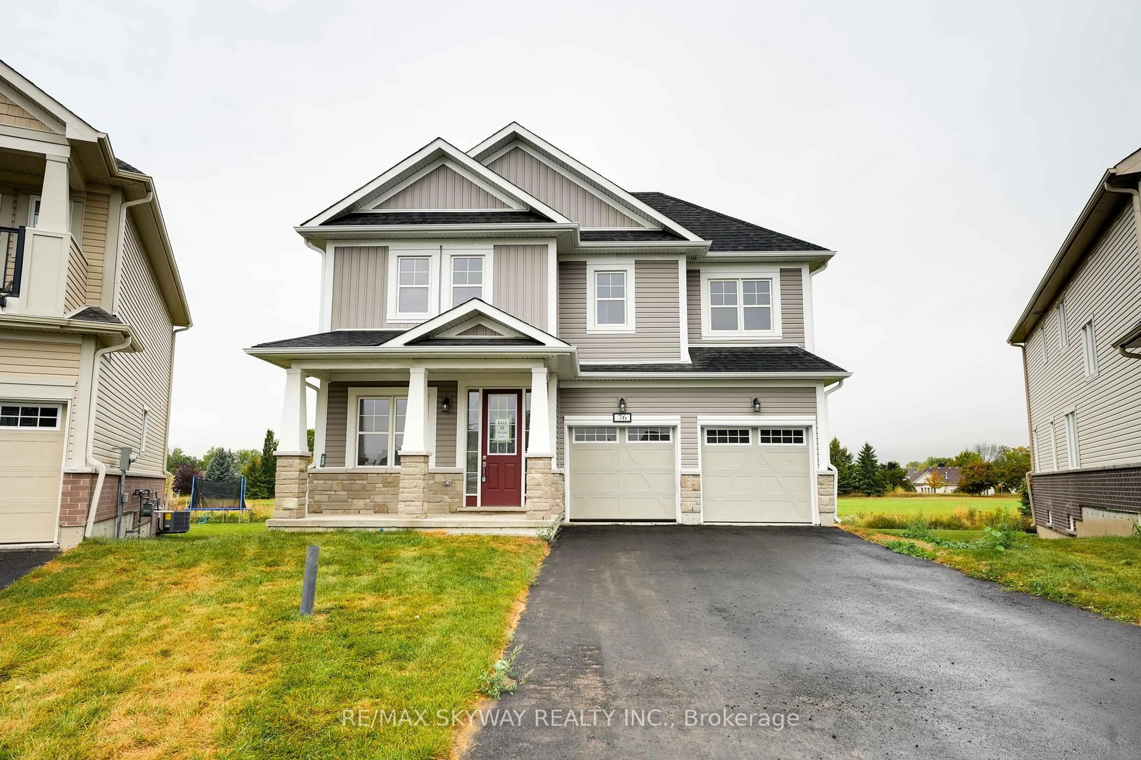 Home with vinyl exterior material, street for 76 Golf Links Dr, Loyalist Ontario K0H 0B4