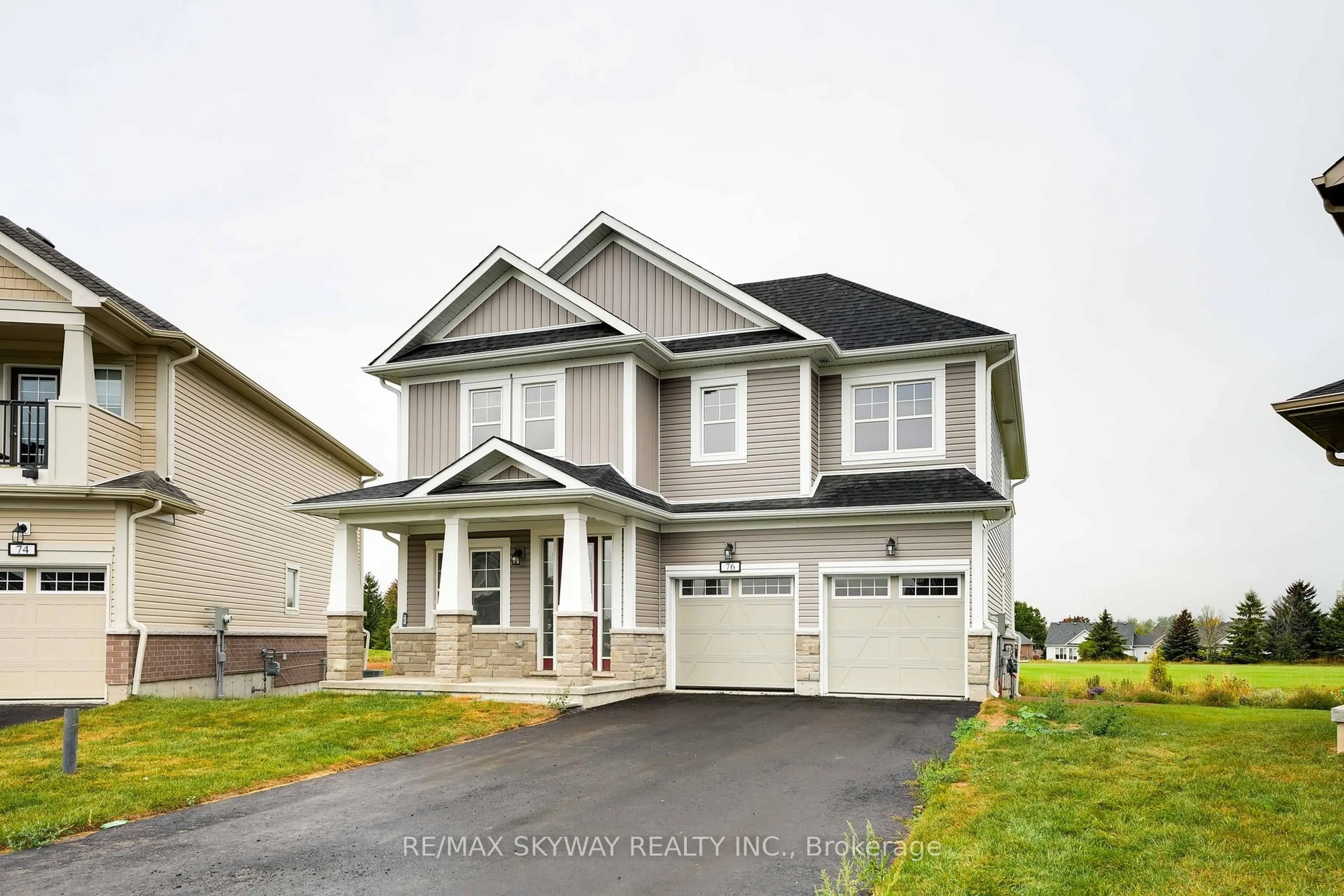 Home with vinyl exterior material, street for 76 Golf Links Dr, Loyalist Ontario K0H 0B4