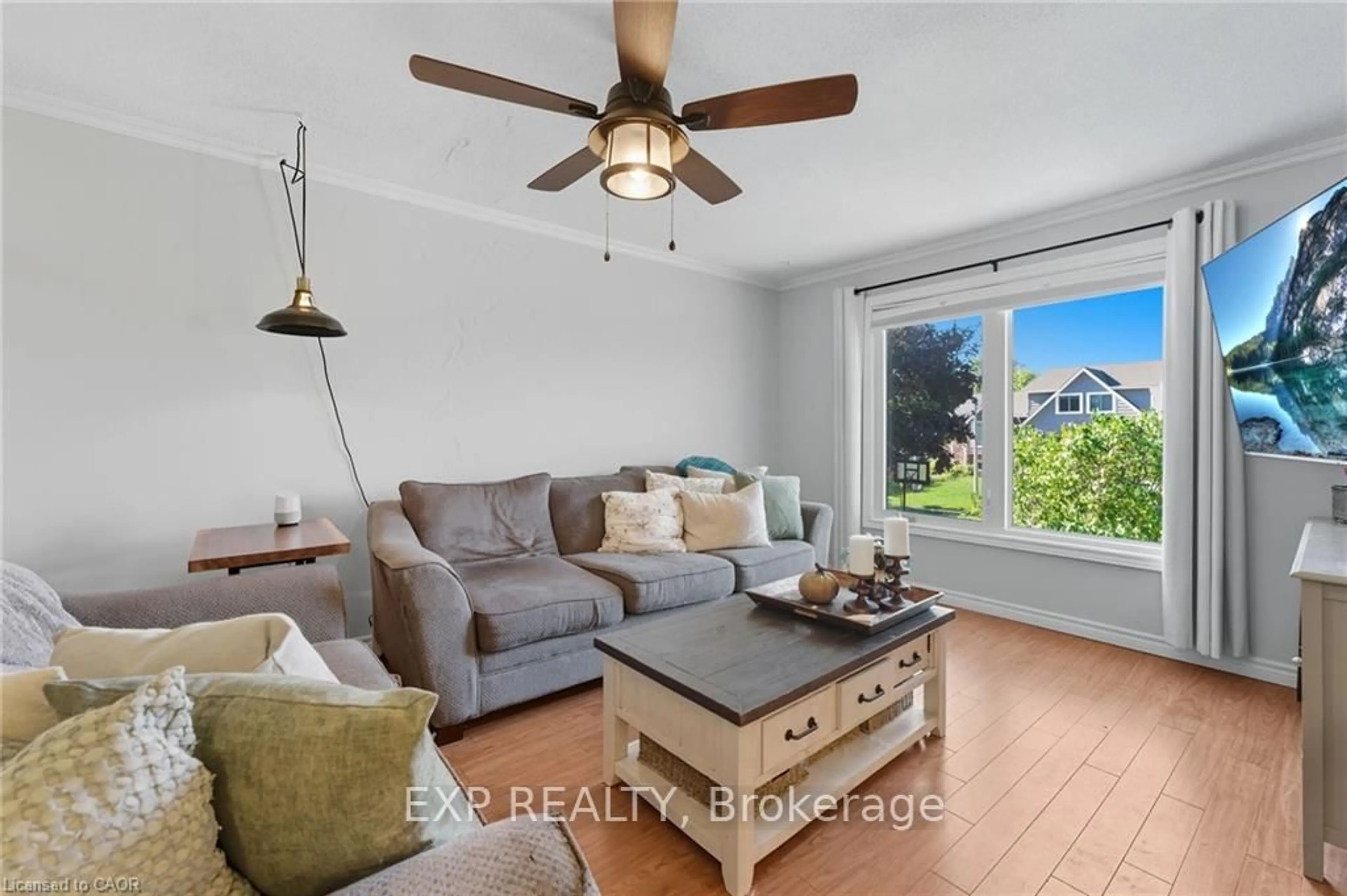 Living room with furniture, wood/laminate floor for 86 Sugar Maple St, Kitchener Ontario N2N 1X7