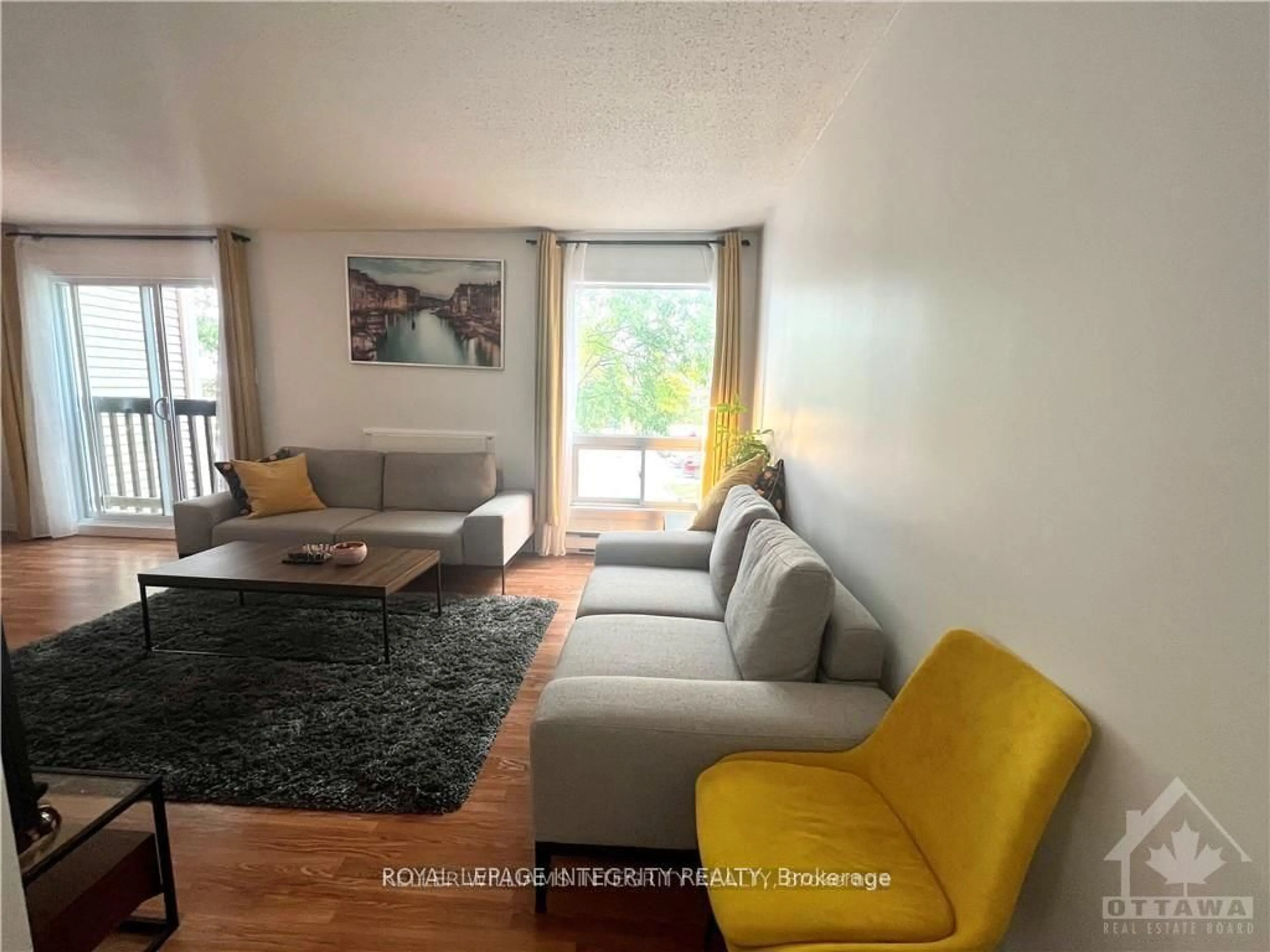 Living room with furniture, wood/laminate floor for 240 FENERTY Crt #8, Ottawa Ontario K2L 3A7