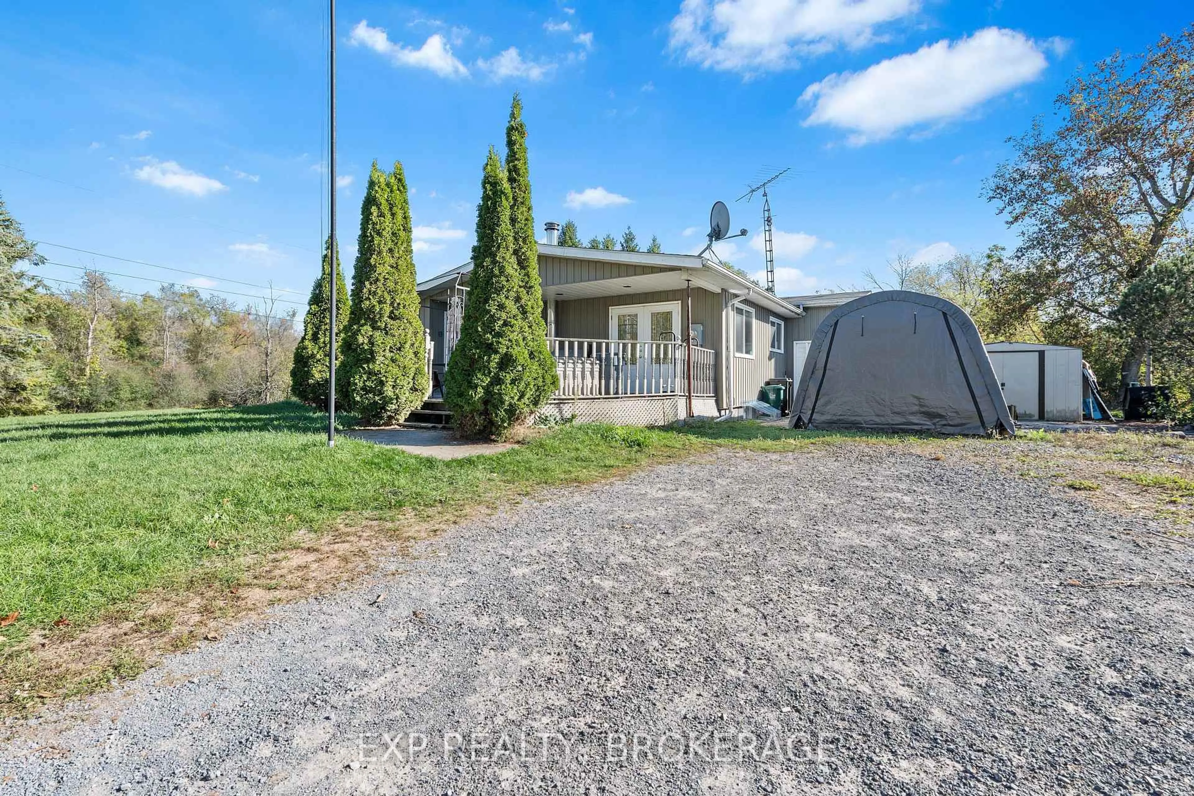 A pic from outside/outdoor area/front of a property/back of a property/a pic from drone, street for 5425 PETWORTH Rd, Harrowsmith Ontario K0H 1V0