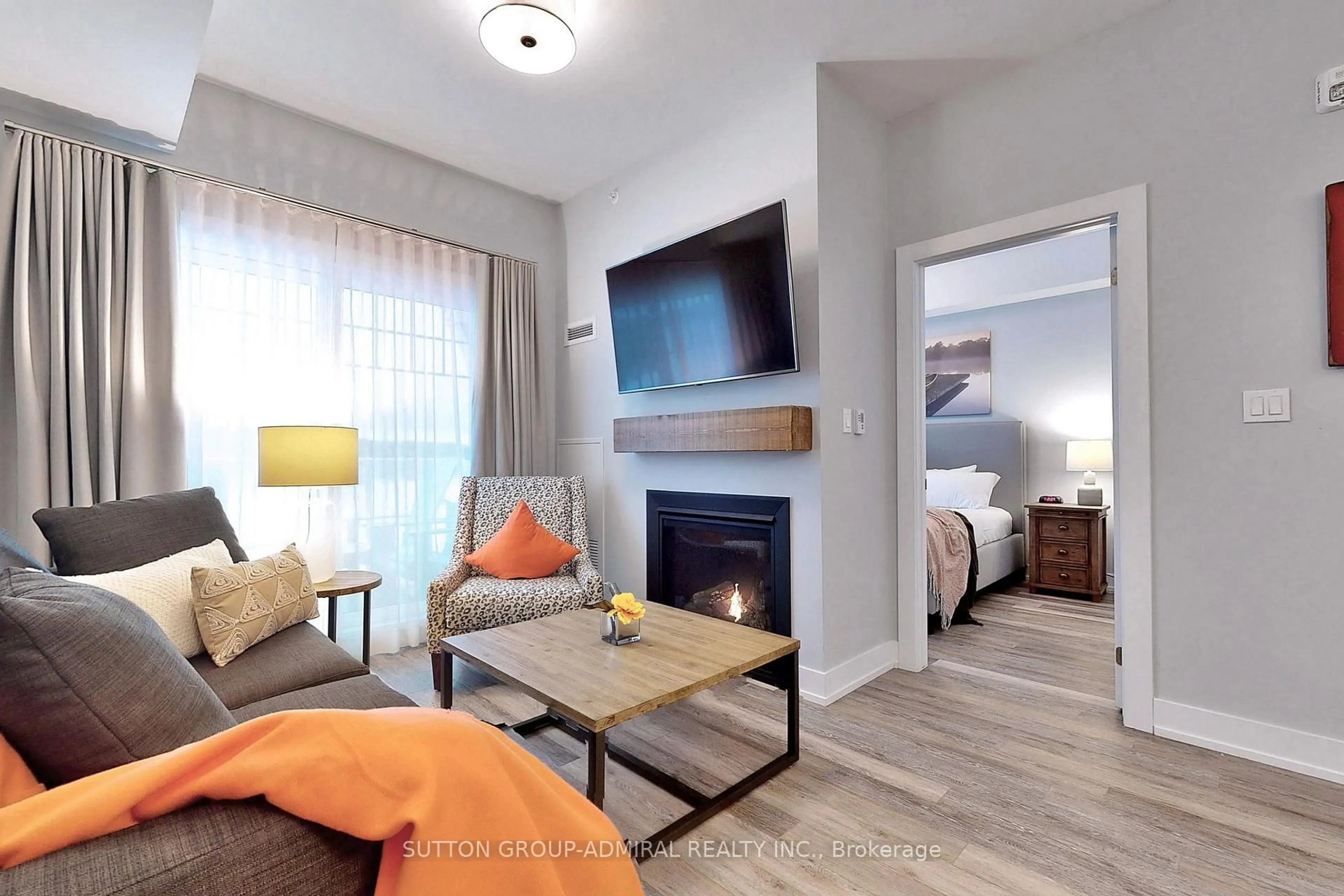 Living room with furniture, wood/laminate floor for 25 Pen Lake Point Rd #425, Huntsville Ontario P1H 1A9