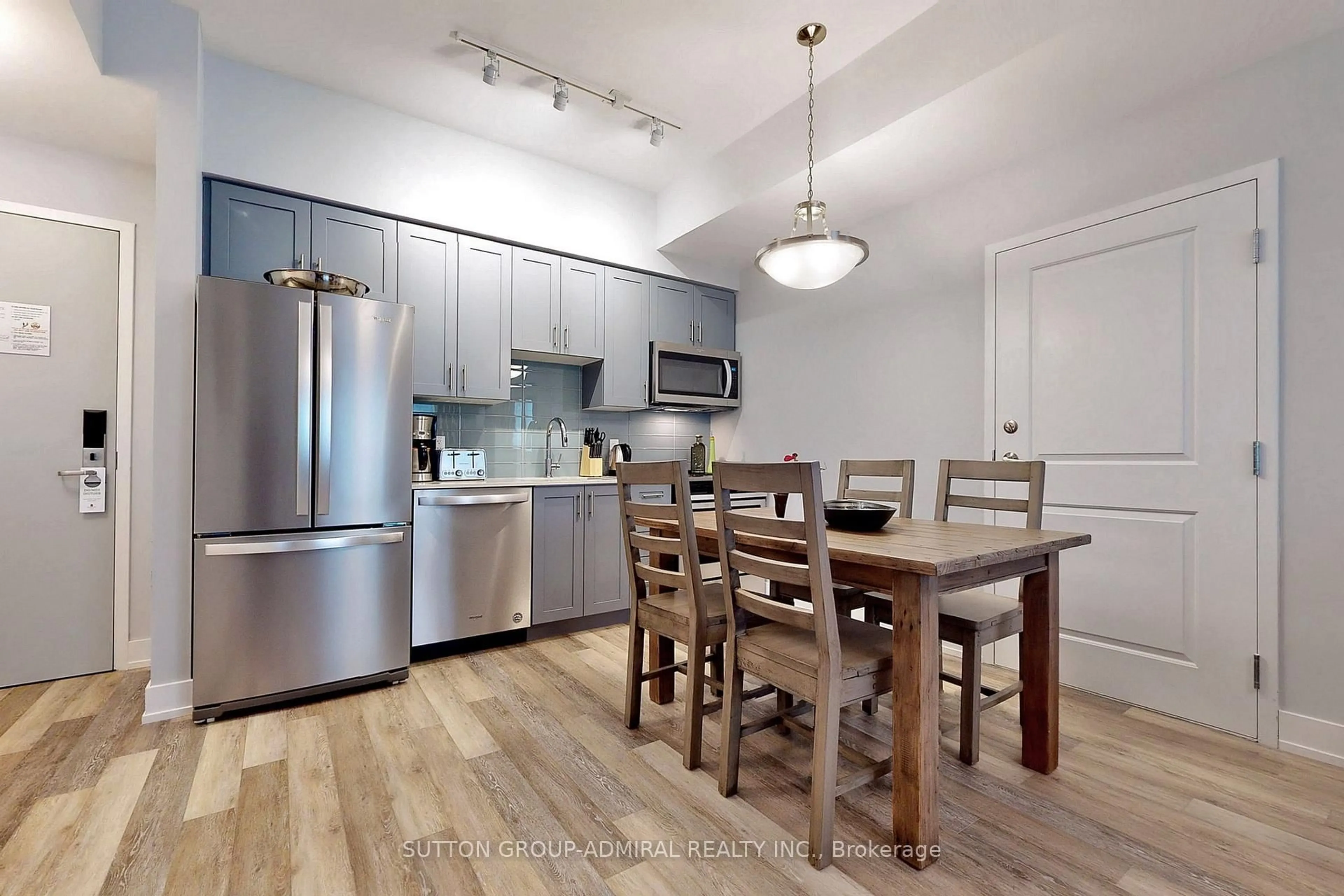 Open concept kitchen, wood/laminate floor for 25 Pen Lake Point Rd #425, Huntsville Ontario P1H 1A9