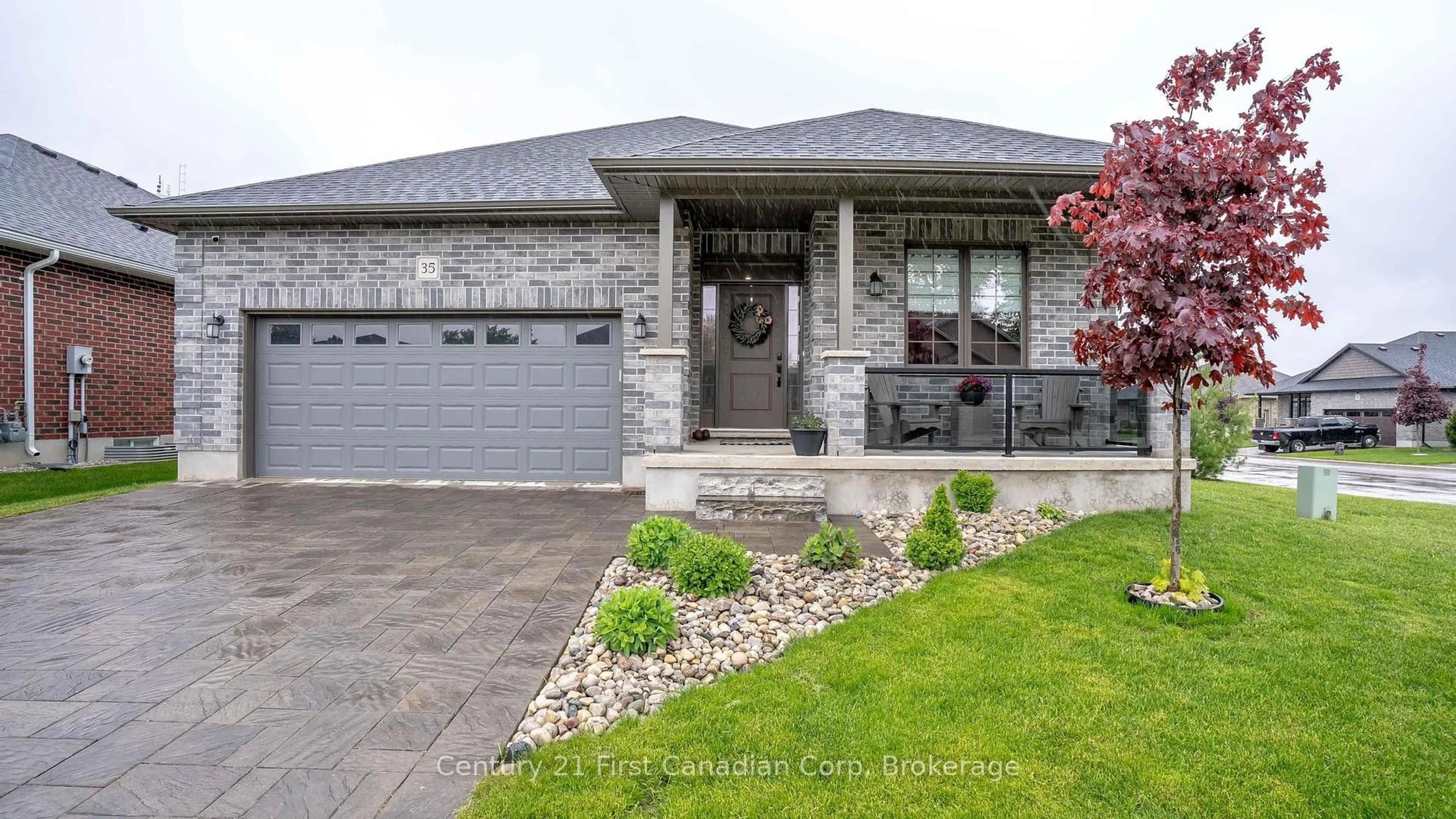 Home with brick exterior material, street for 121 Robin Ridge Dr #35, Central Elgin Ontario L0L 1B0