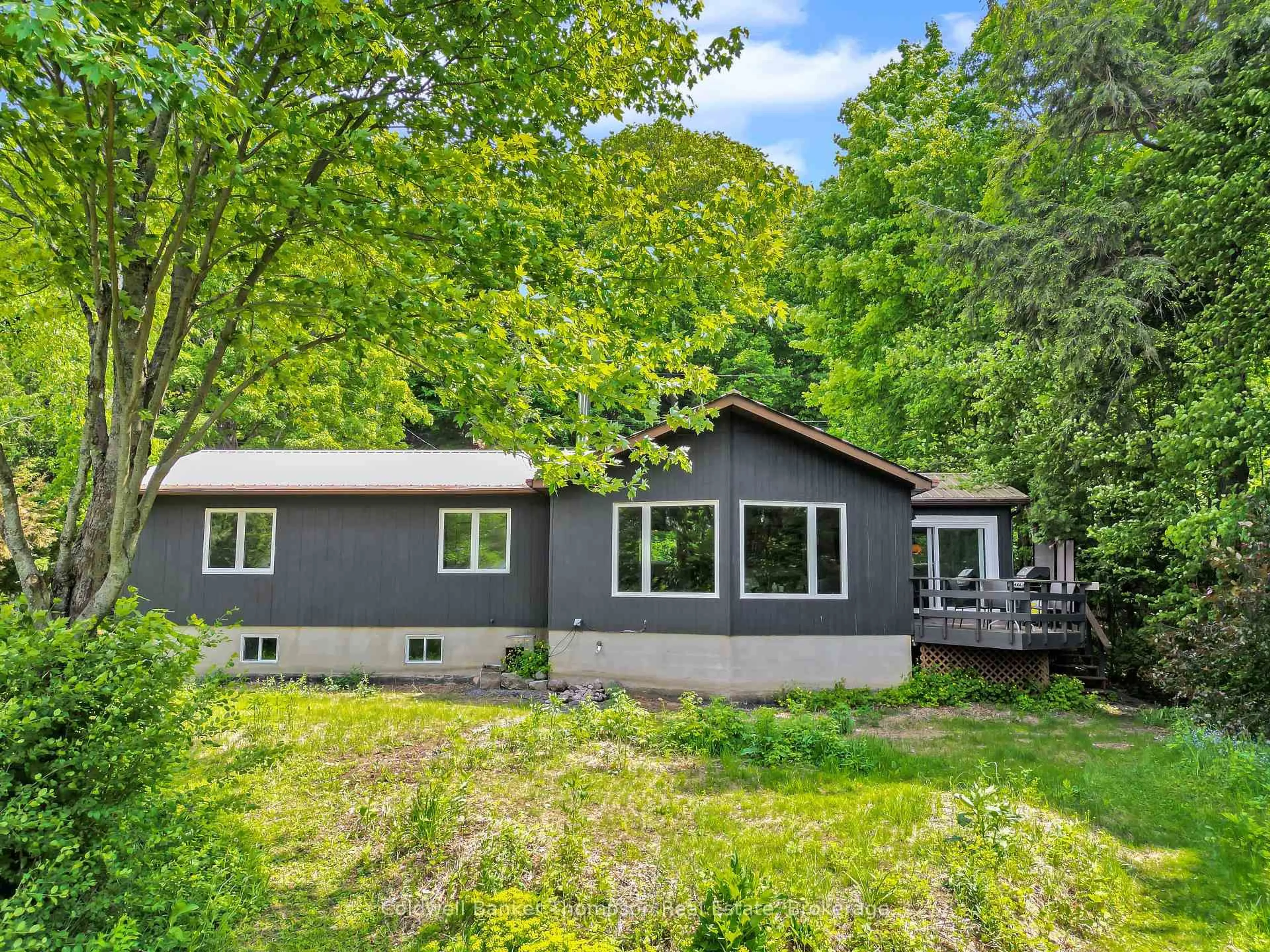A pic from outside/outdoor area/front of a property/back of a property/a pic from drone, unknown for 810 East Waseosa Lake Rd, Huntsville Ontario P1H 2J4