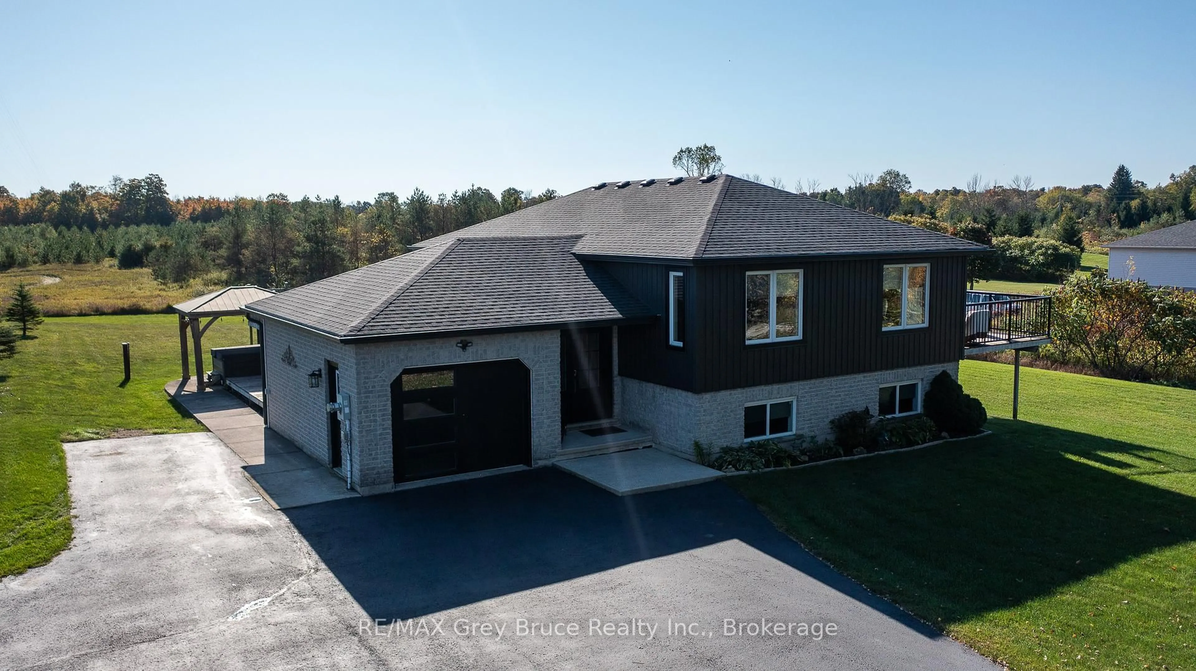 A pic from outside/outdoor area/front of a property/back of a property/a pic from drone, building for 200050 10 Sdrd, Georgian Bluffs Ontario N0H 2K0