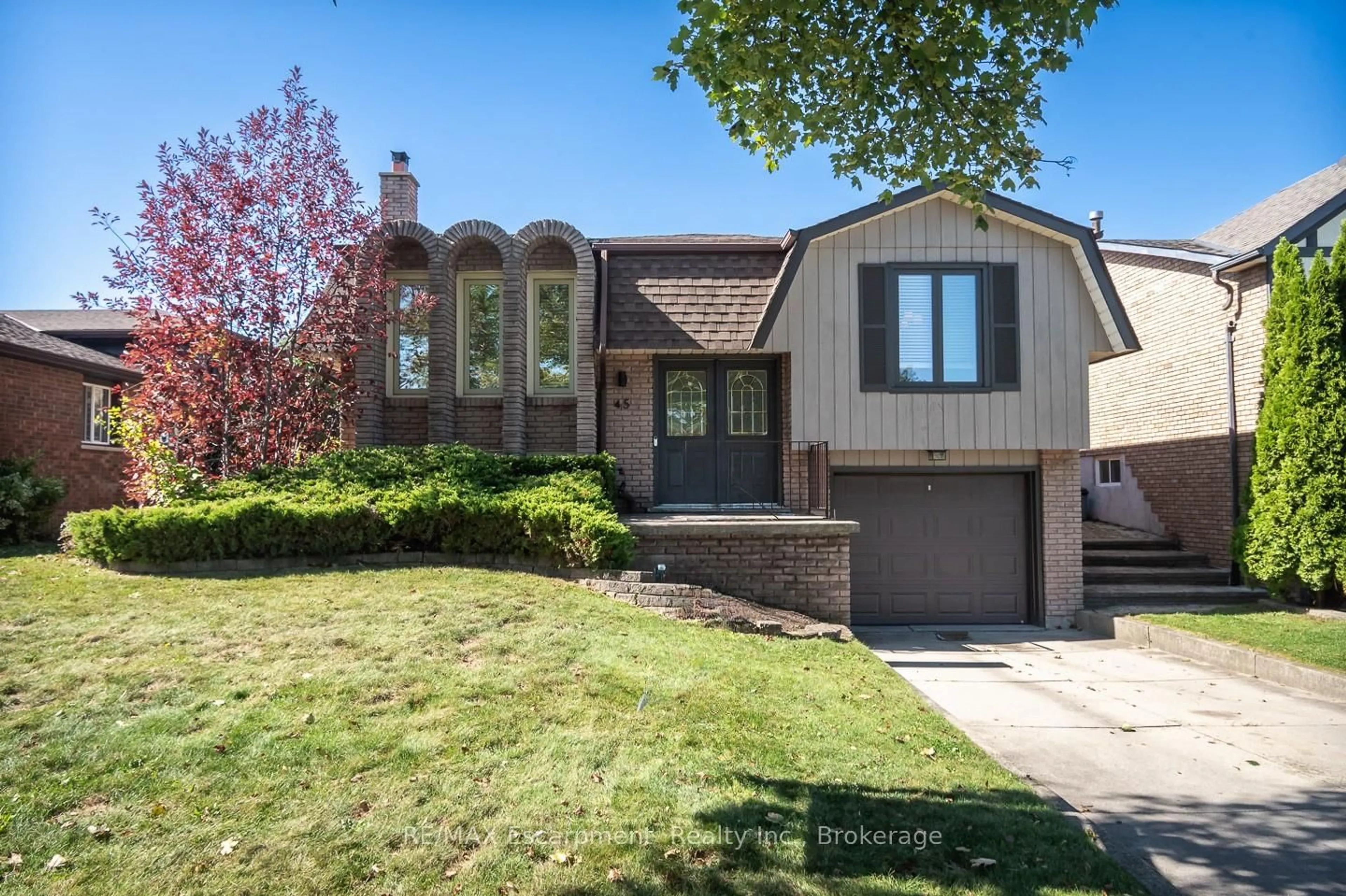 Home with brick exterior material, street for 45 Amberwood St, Hamilton Ontario L8J 1J1