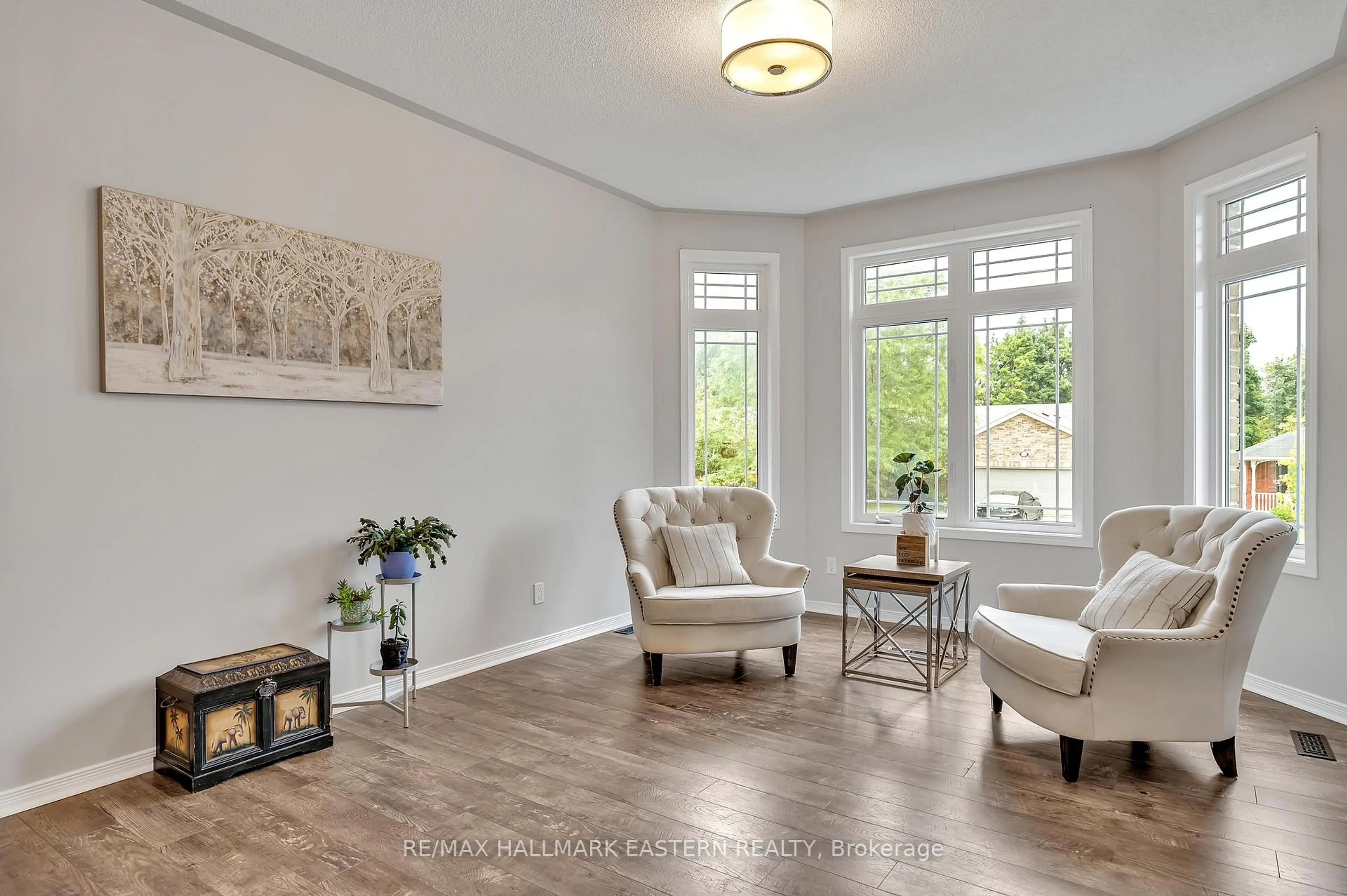 Living room with furniture, wood/laminate floor for 1787 Waddell Ave, Peterborough Ontario K9K 2G5