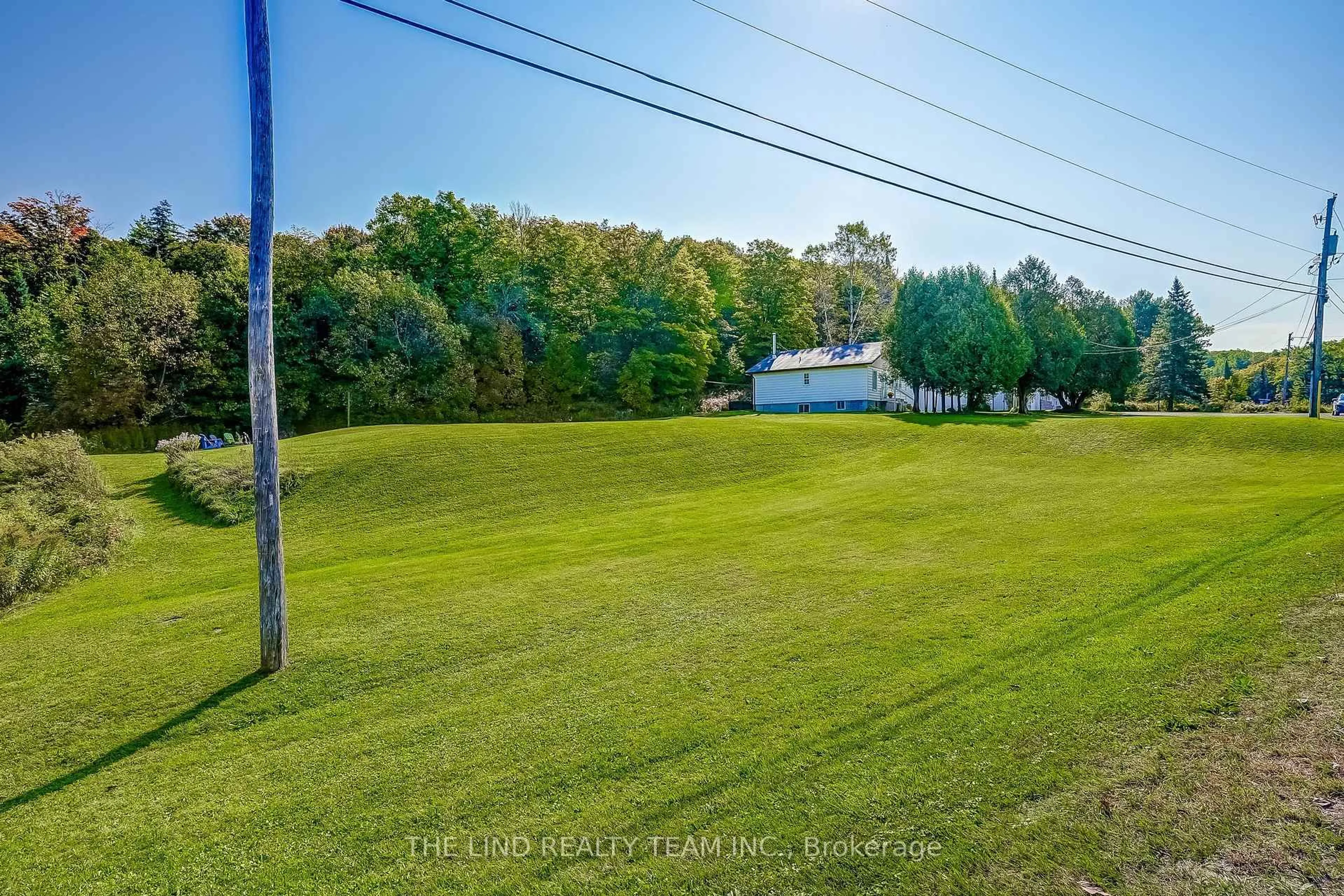A pic from outside/outdoor area/front of a property/back of a property/a pic from drone, water/lake/river/ocean view for 949 Raymond Rd, Muskoka Lakes Ontario P0B 1M0