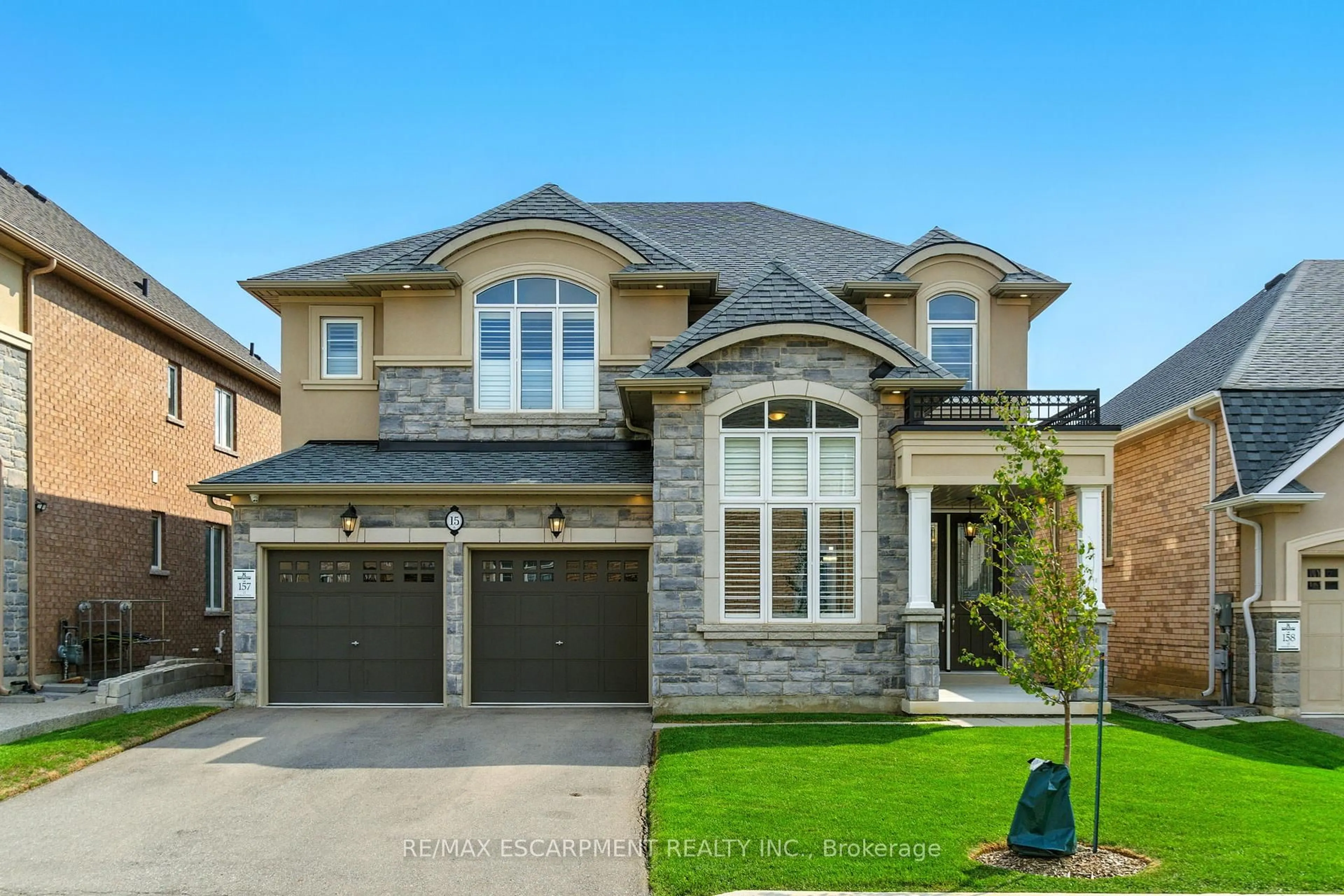 Home with brick exterior material, street for 15 Robarts Dr, Hamilton Ontario L9K 0H6