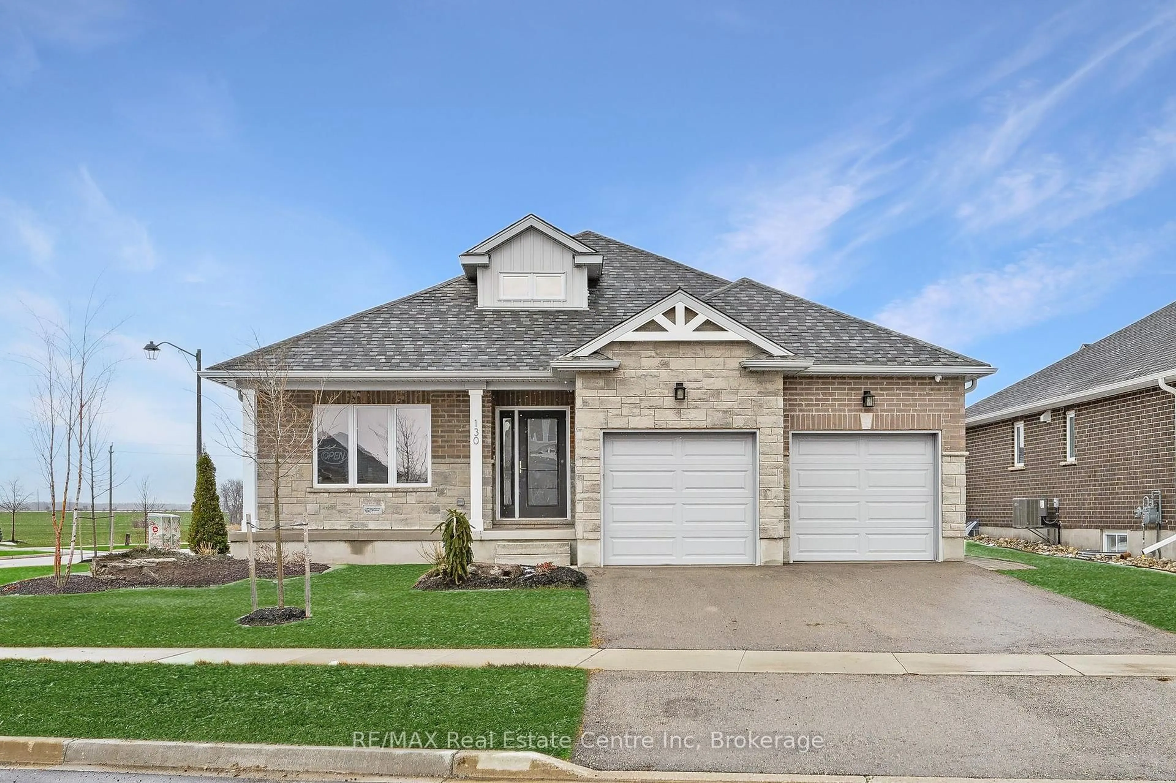 Home with brick exterior material, street for 130 Stephenson Way, Minto Ontario N0G 2P0
