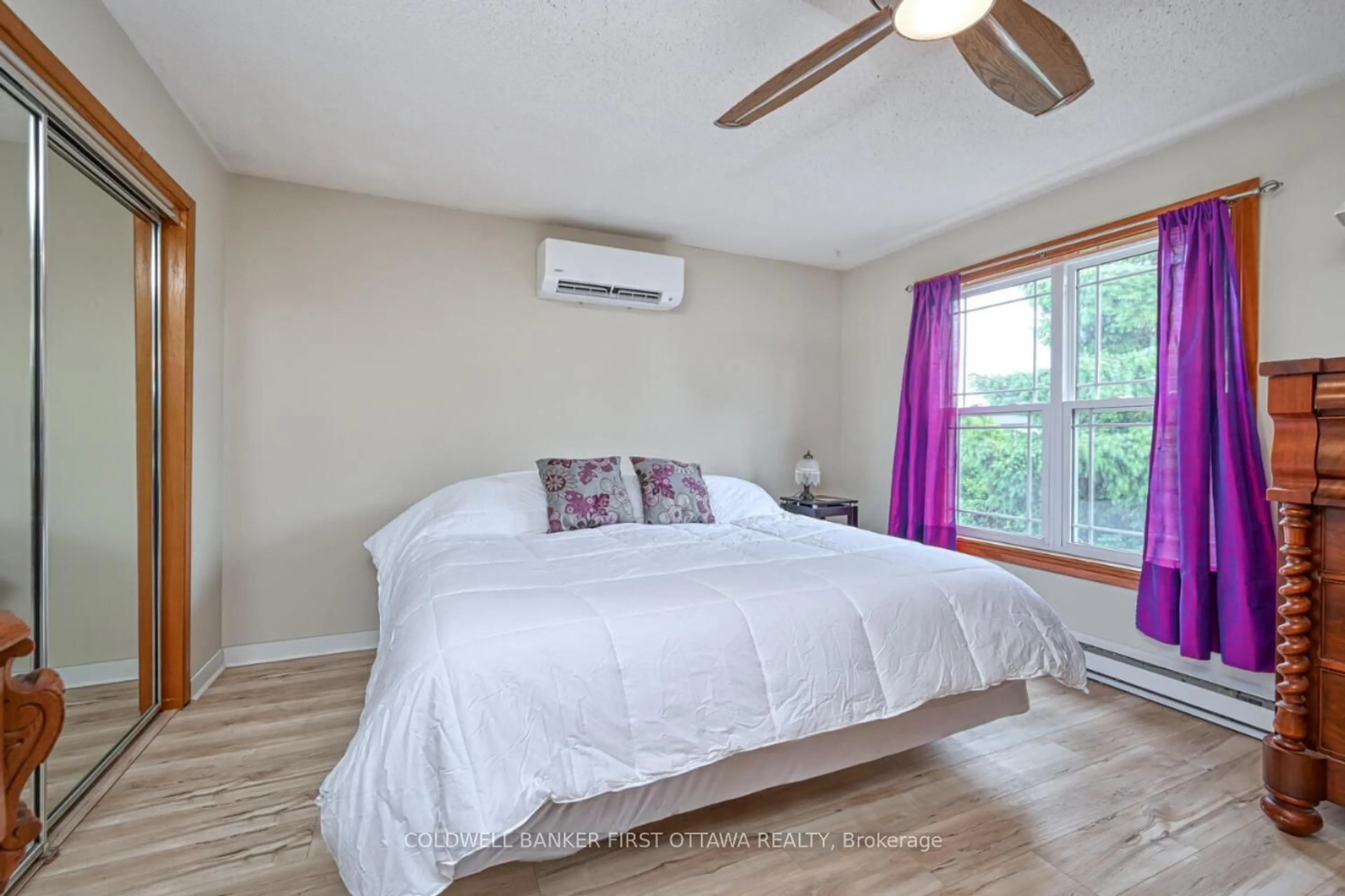 Bedroom with bed, wood/laminate floor for 22 Poole Creek Cres, Stittsville Ontario K2S 1G4