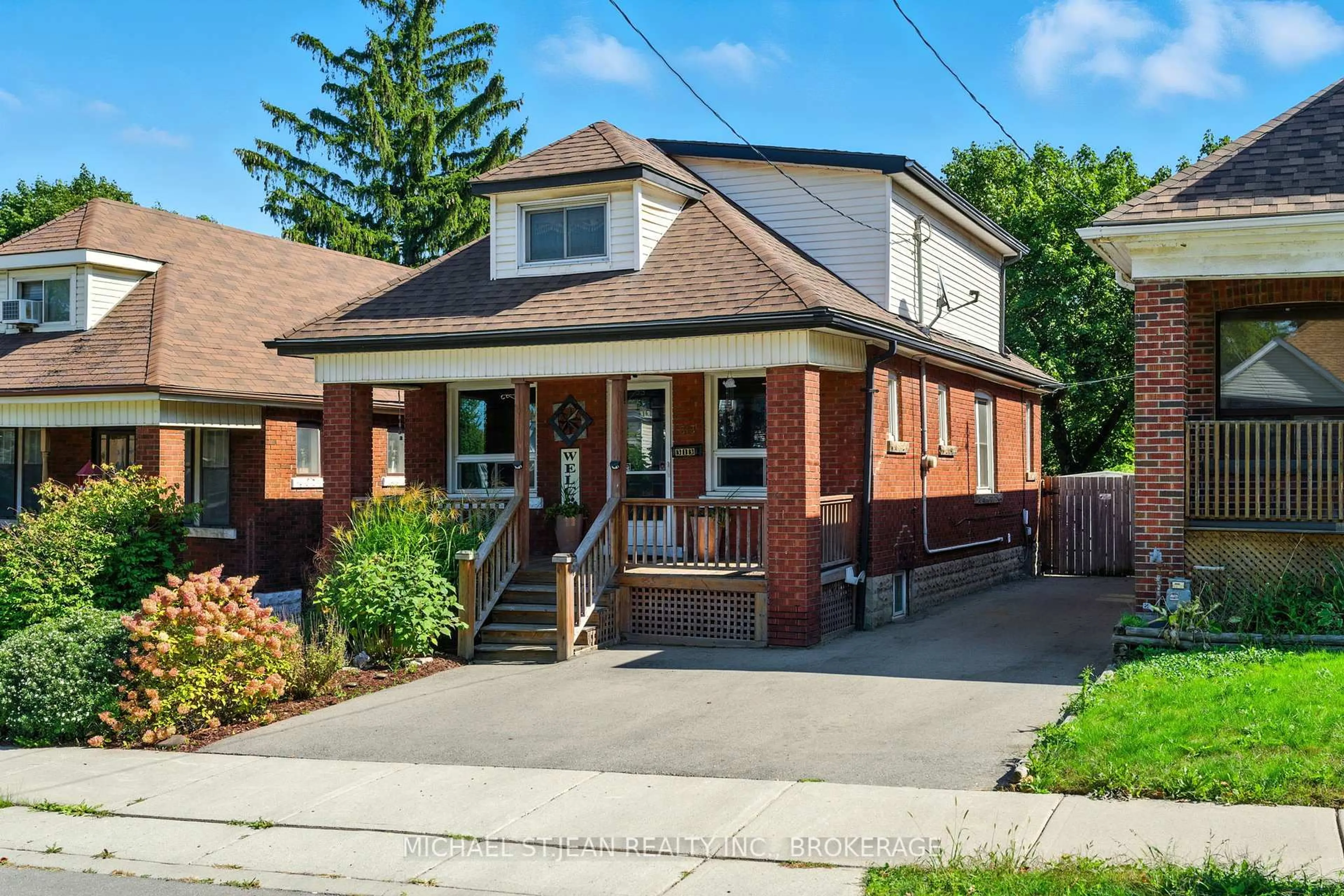 Home with brick exterior material, street for 313 Graham Ave, Hamilton Ontario L8K 2M7