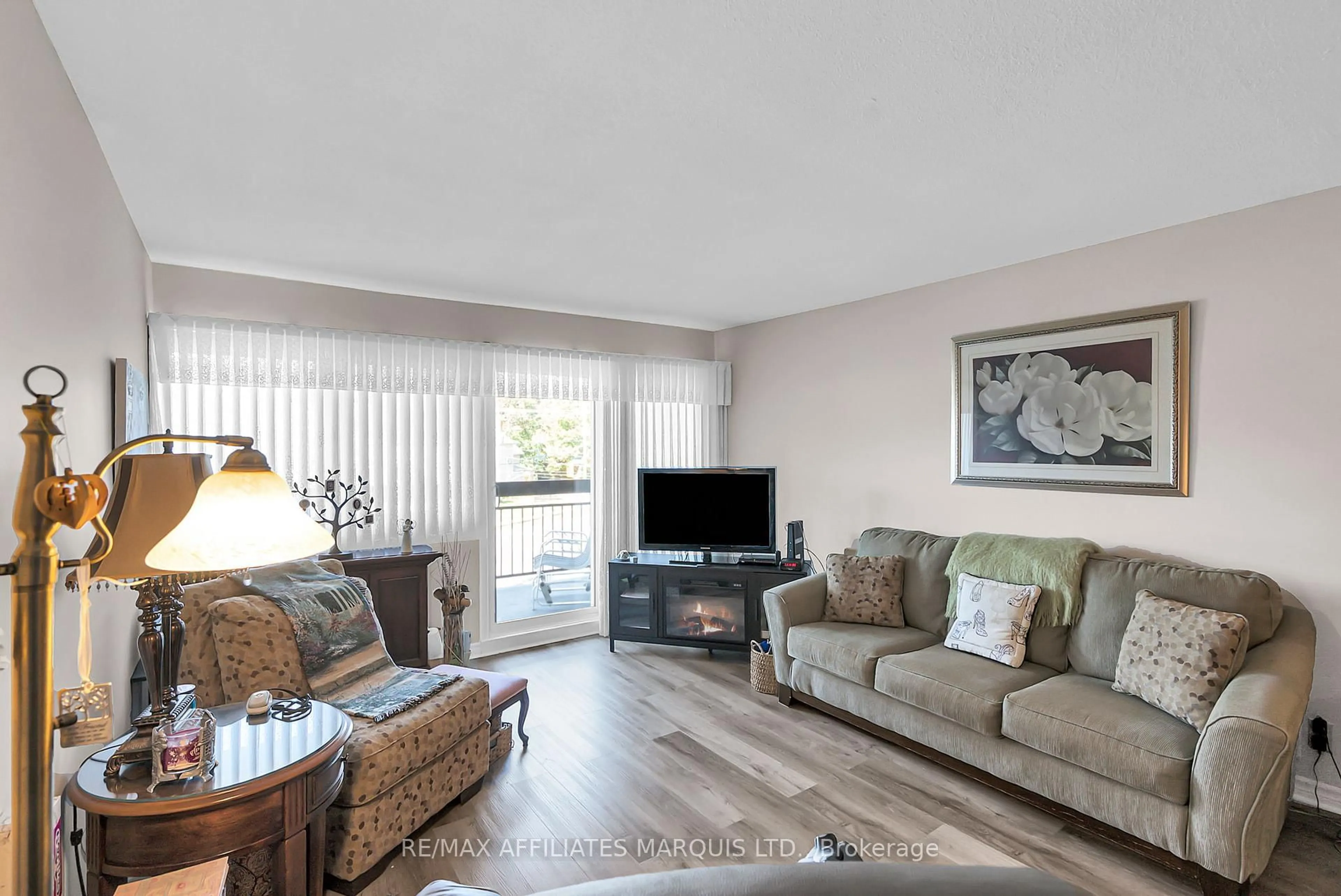 Living room with furniture, wood/laminate floor for 308 Second St #302, Cornwall Ontario K6H 1Z1