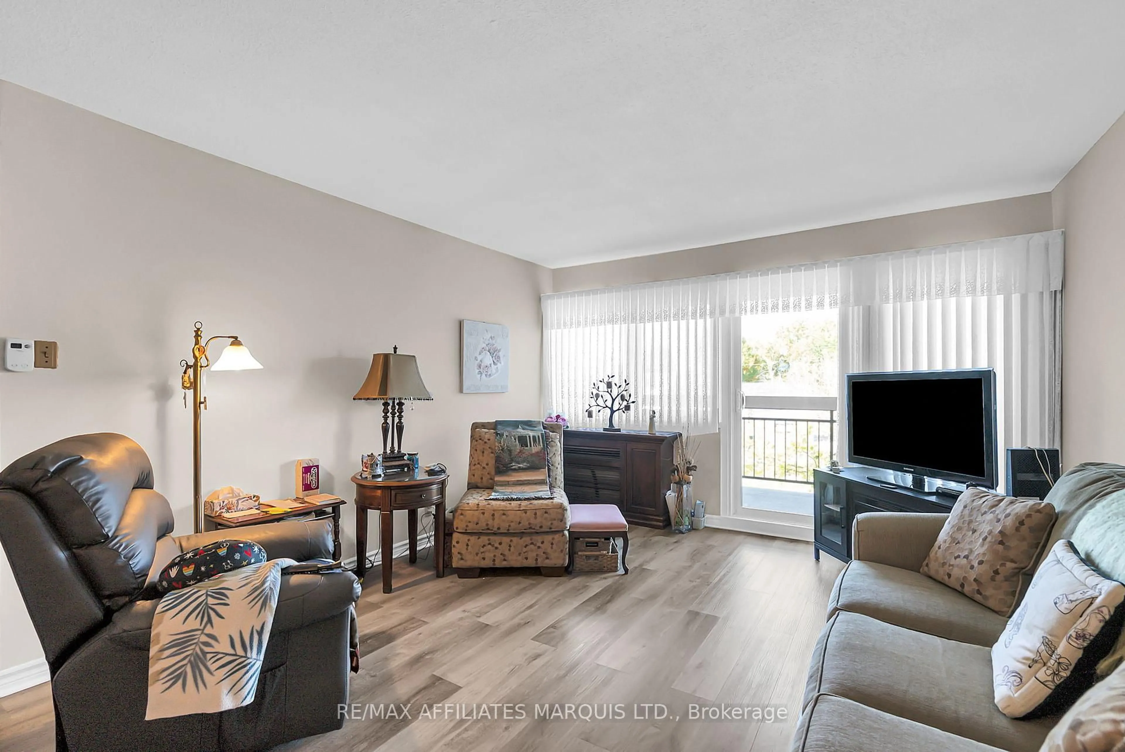Living room with furniture, wood/laminate floor for 308 Second St #302, Cornwall Ontario K6H 1Z1