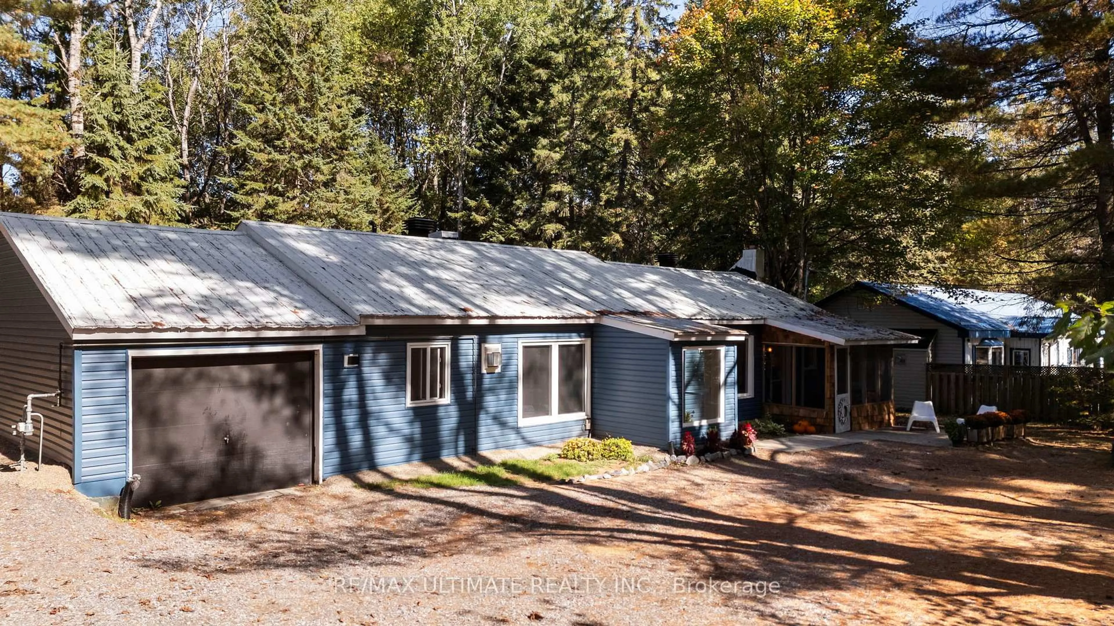 Home with vinyl exterior material, street for 328 Muskoka Rd 10 Rd, Huntsville Ontario P0B 1L0