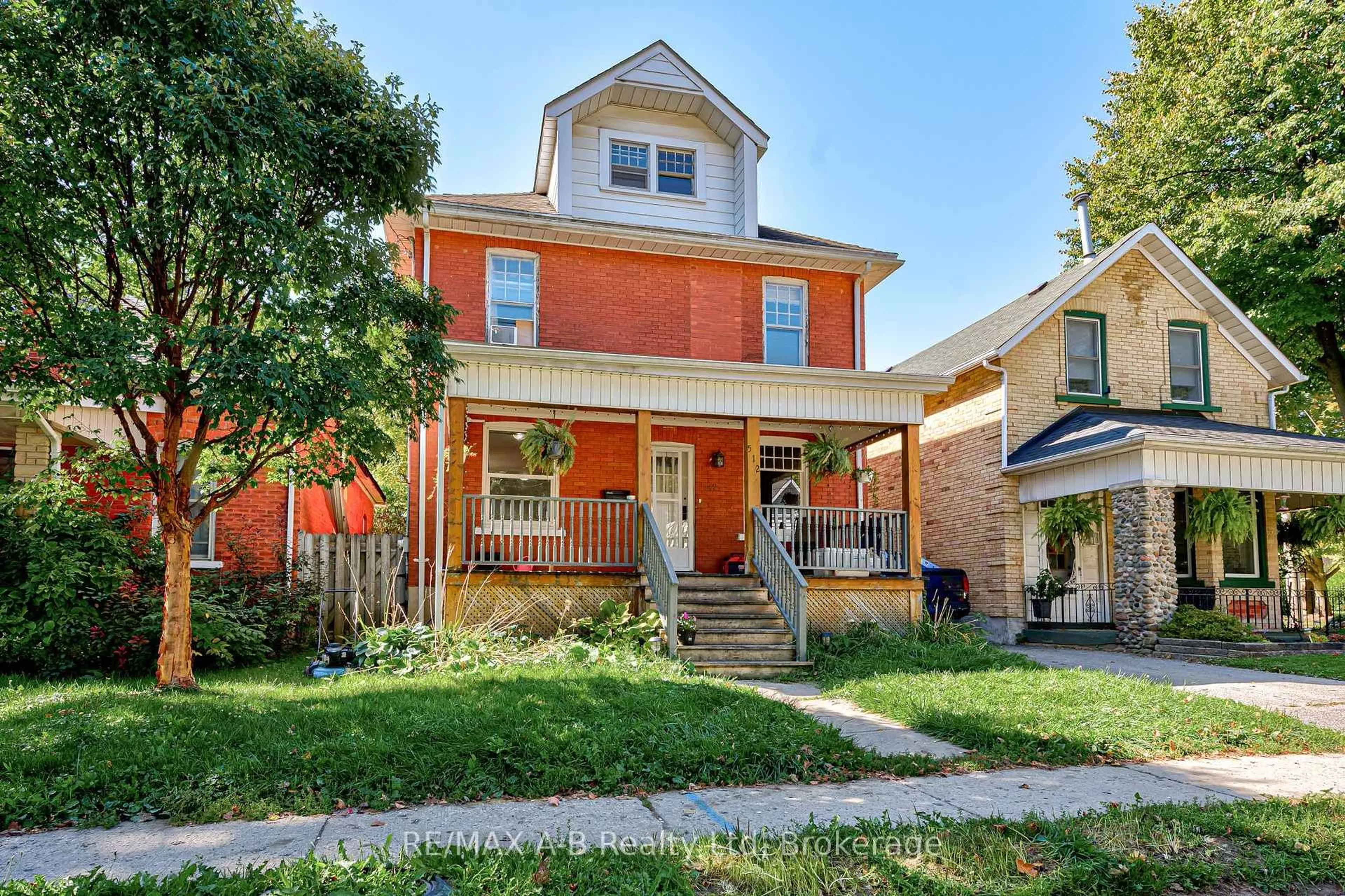 Home with brick exterior material, street for 512 Downie St, Stratford Ontario N5A 1Y2