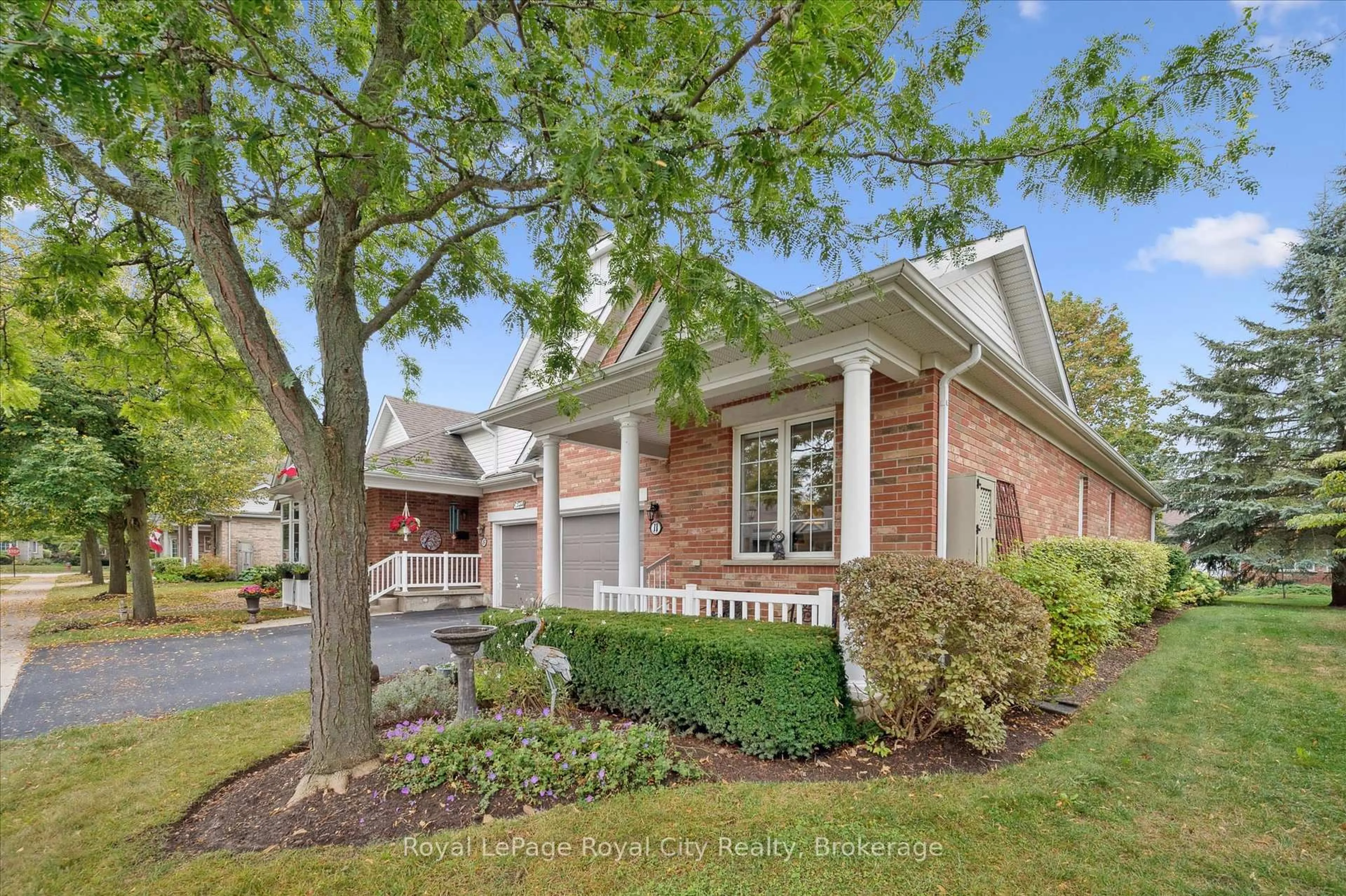 Home with brick exterior material, street for 11 Magnolia Lane, Guelph Ontario N1G 4X7
