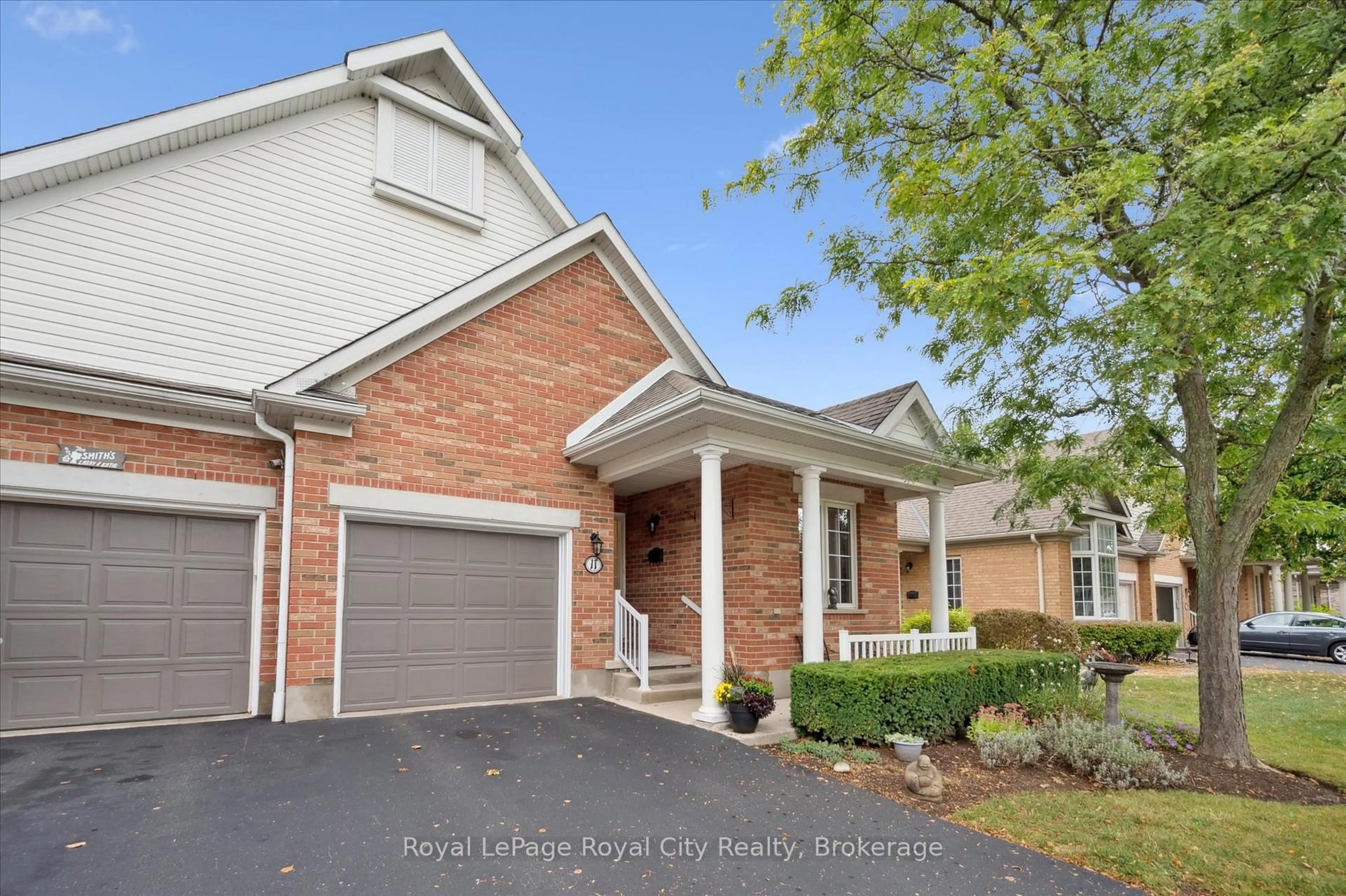 Home with brick exterior material, street for 11 Magnolia Lane, Guelph Ontario N1G 4X7