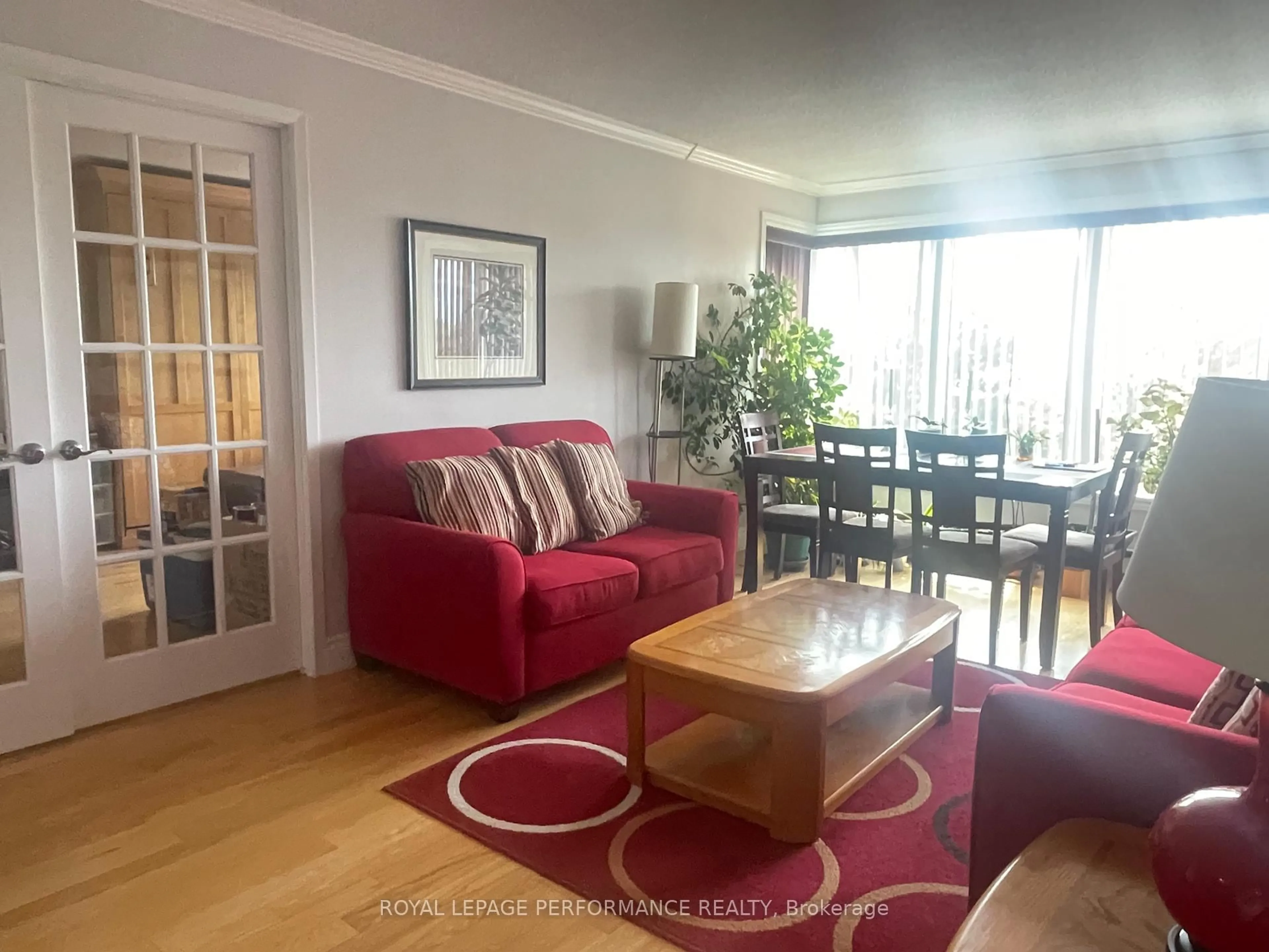 Living room with furniture, wood/laminate floor for 225 Alvin Road Rd #507, Ottawa Ontario K1K 4H6