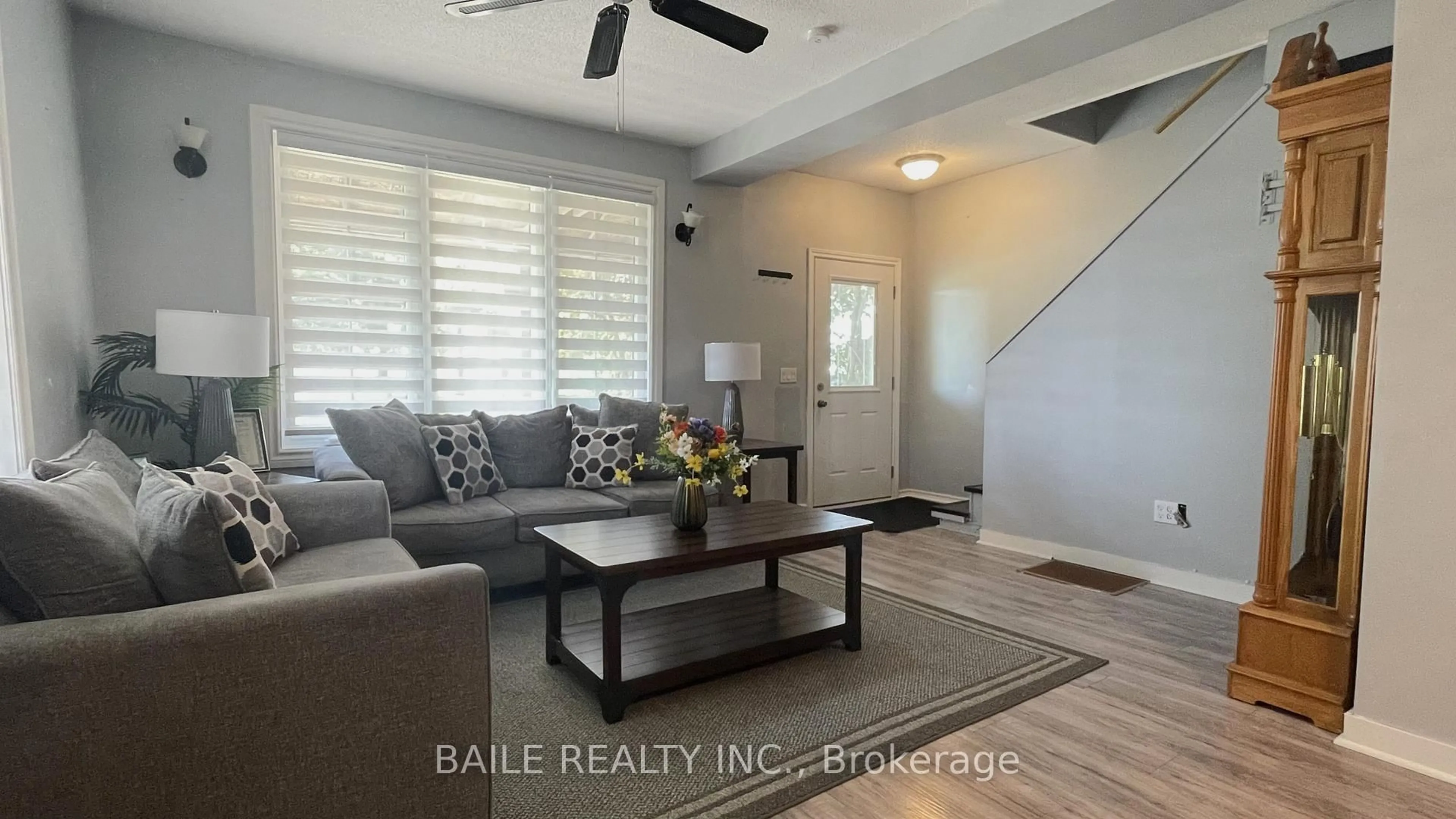 Living room with furniture, wood/laminate floor for 6534 James St, Brooke-Alvinston Ontario N0M 2S0