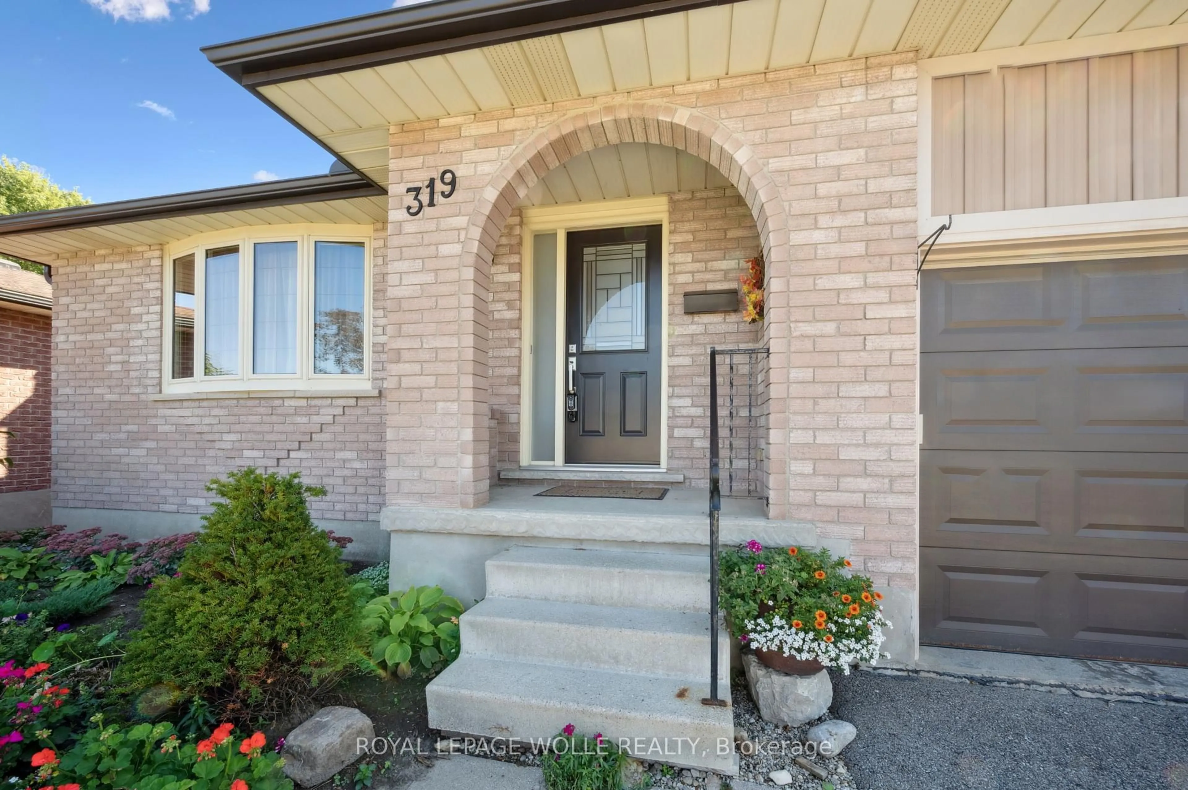 Home with brick exterior material, street for 319 Conservation Dr, Waterloo Ontario N2V 1V2