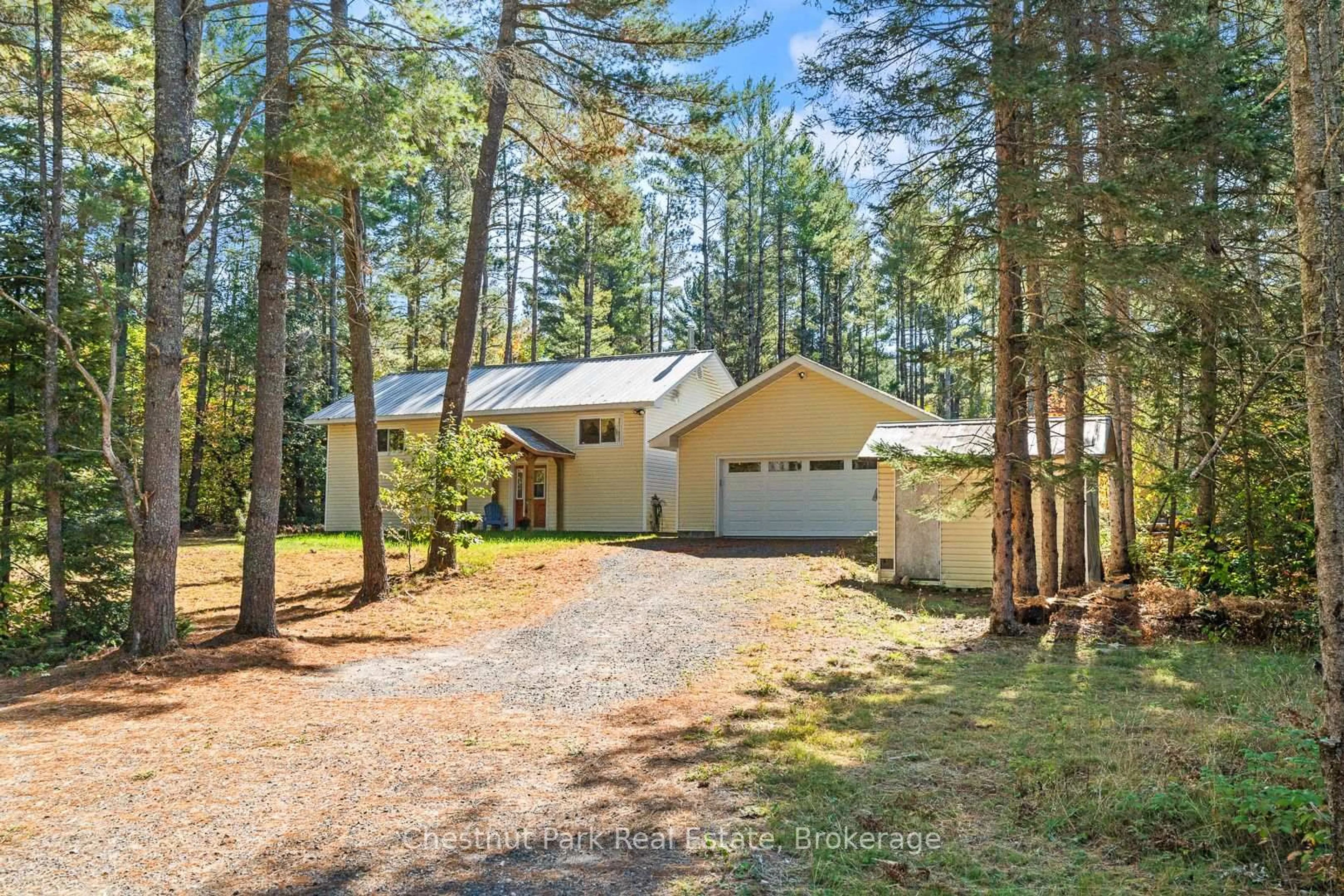 A pic from outside/outdoor area/front of a property/back of a property/a pic from drone, forest/trees view for 2830 Etwell Rd, Huntsville Ontario P1H 2J2