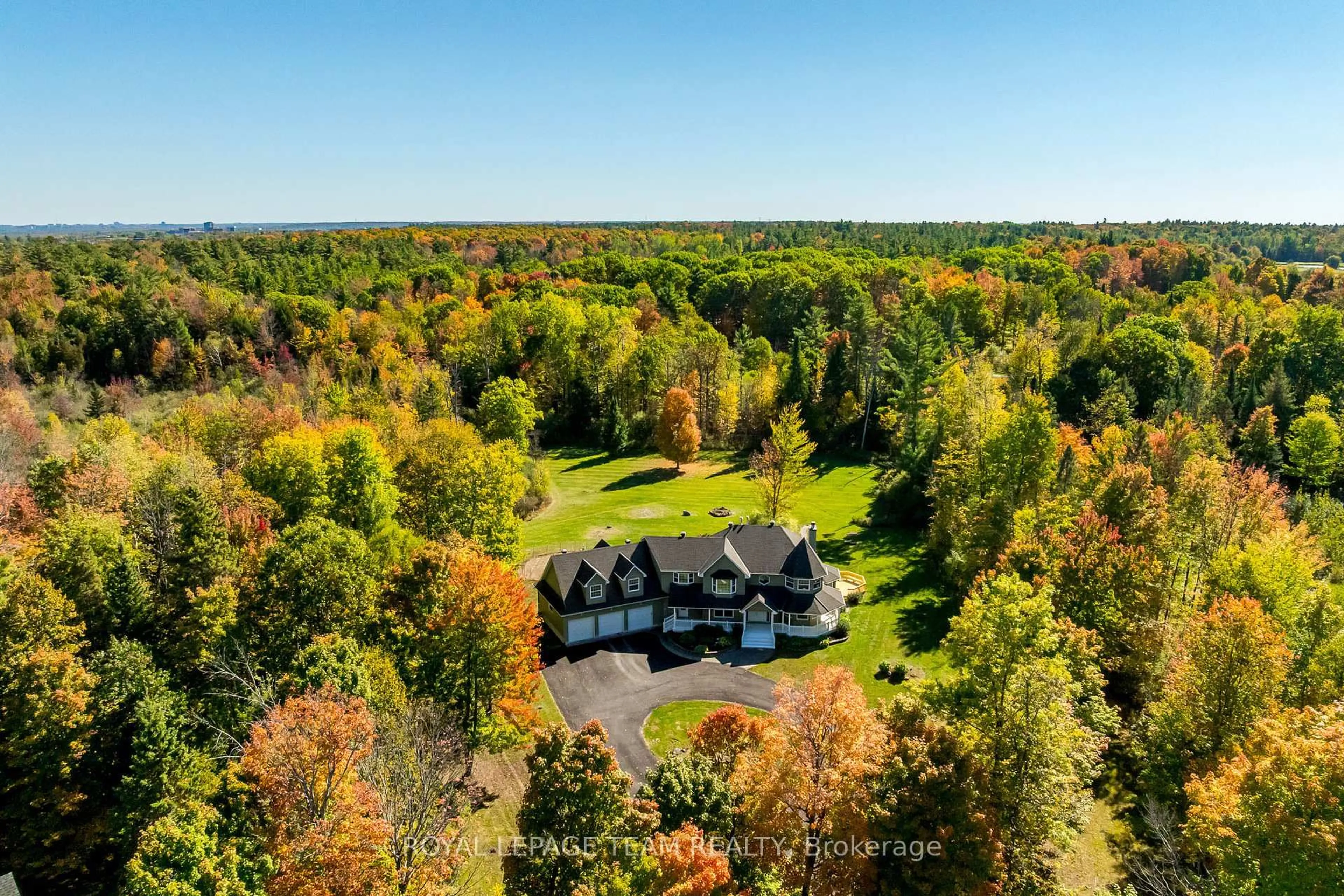 A pic from outside/outdoor area/front of a property/back of a property/a pic from drone, forest/trees view for 38 Marchvale Dr, Ottawa Ontario K2W 1C2
