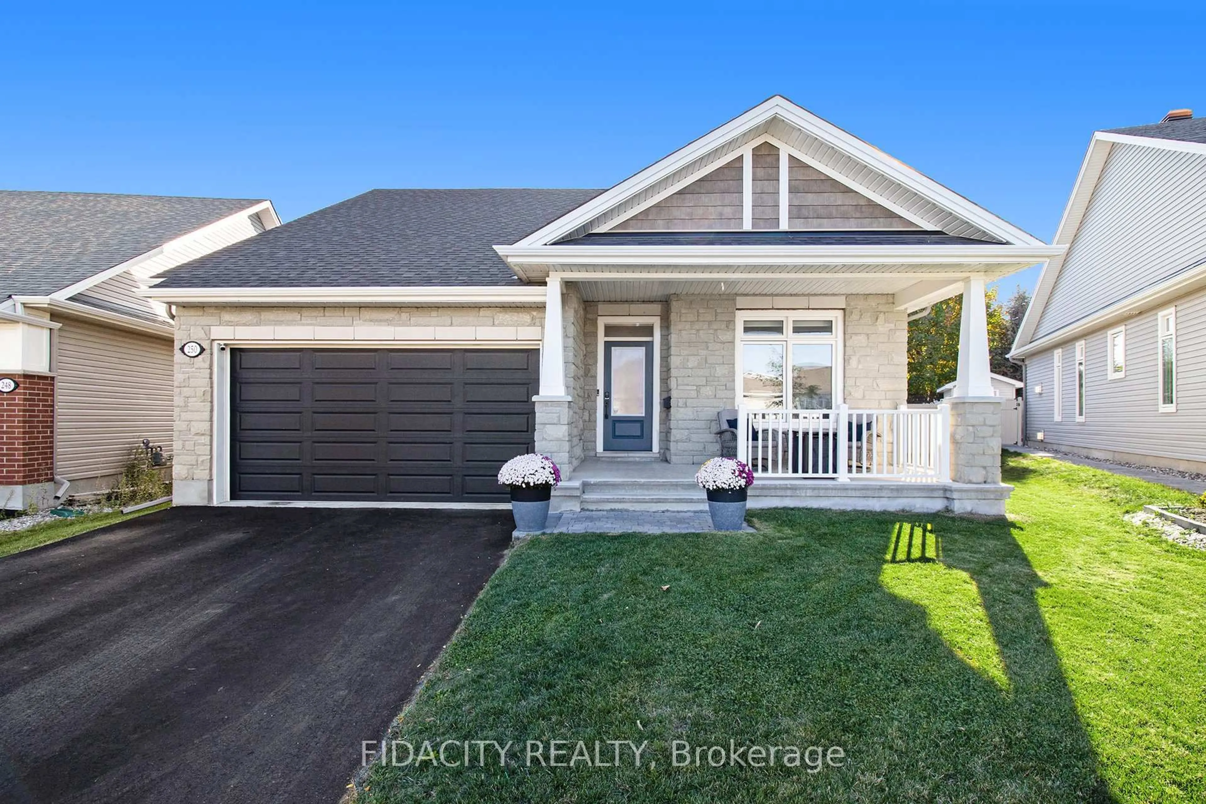 Home with vinyl exterior material, street for 250 Maygrass Way, Ottawa Ontario K2S 2K9