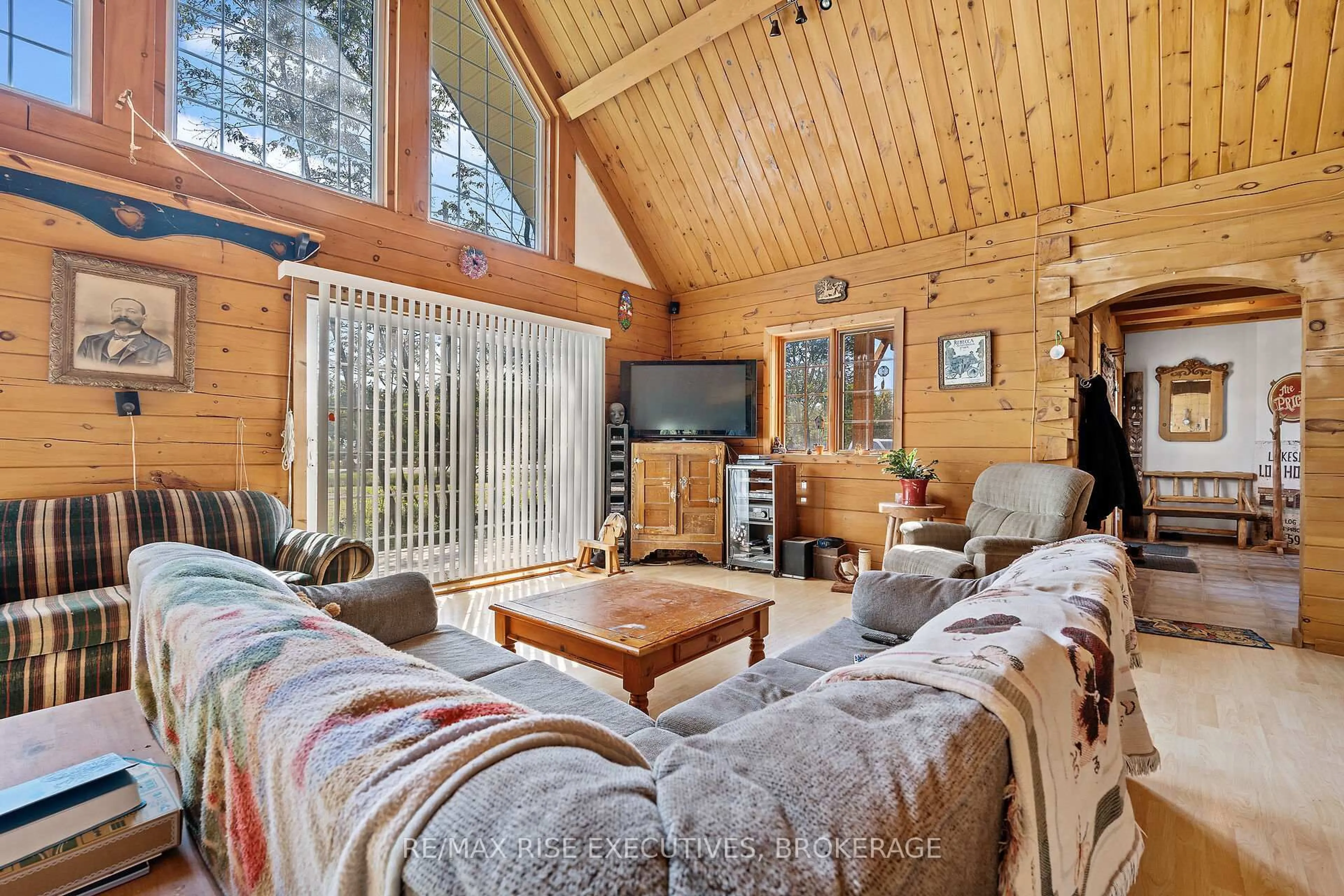 Living room with furniture, wood/laminate floor for 1758 Highway 15, Rideau Lakes Ontario K0G 1E0