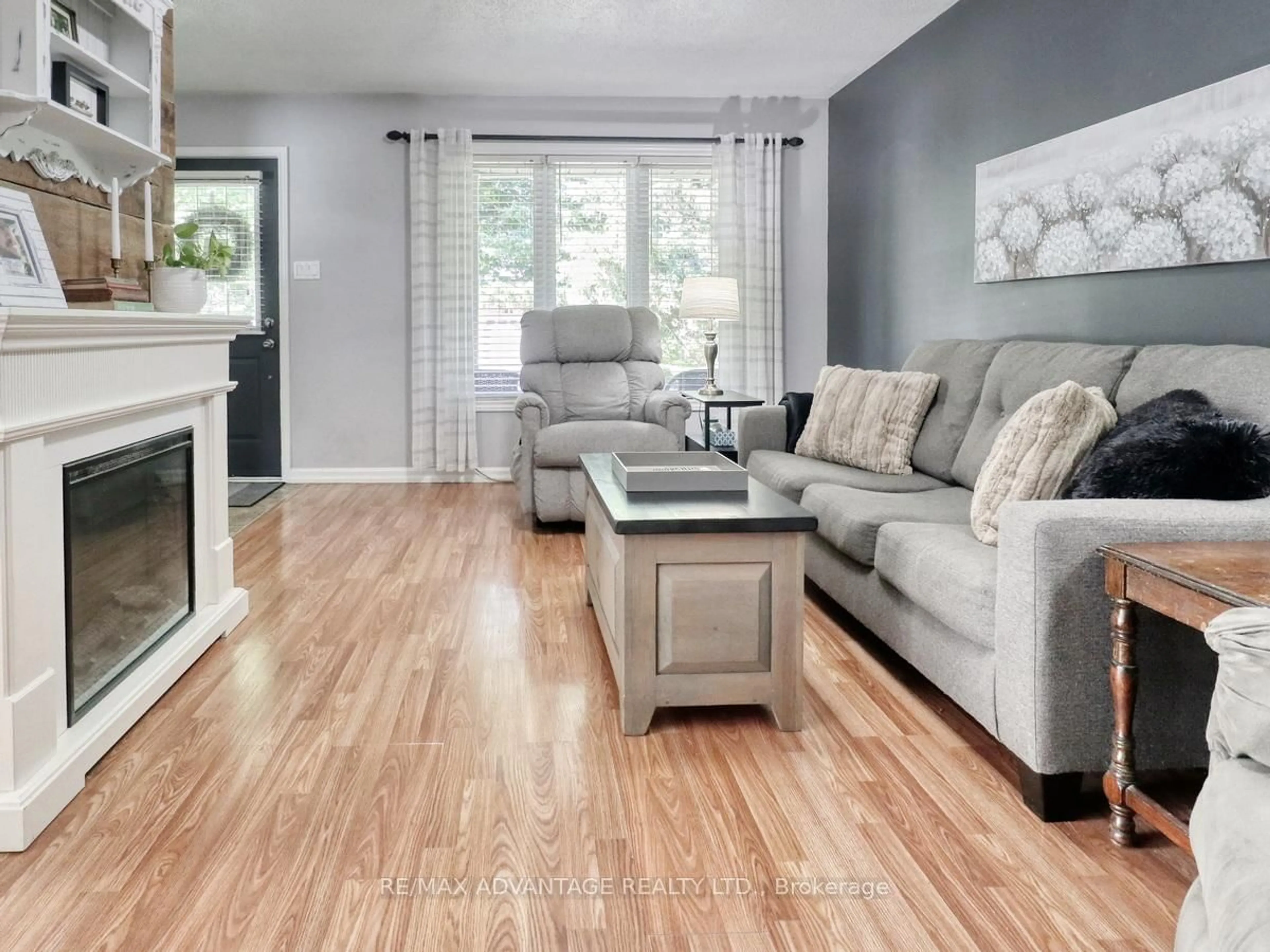 Living room with furniture, wood/laminate floor for 59 Buchan Rd, London East Ontario N5V 4H6