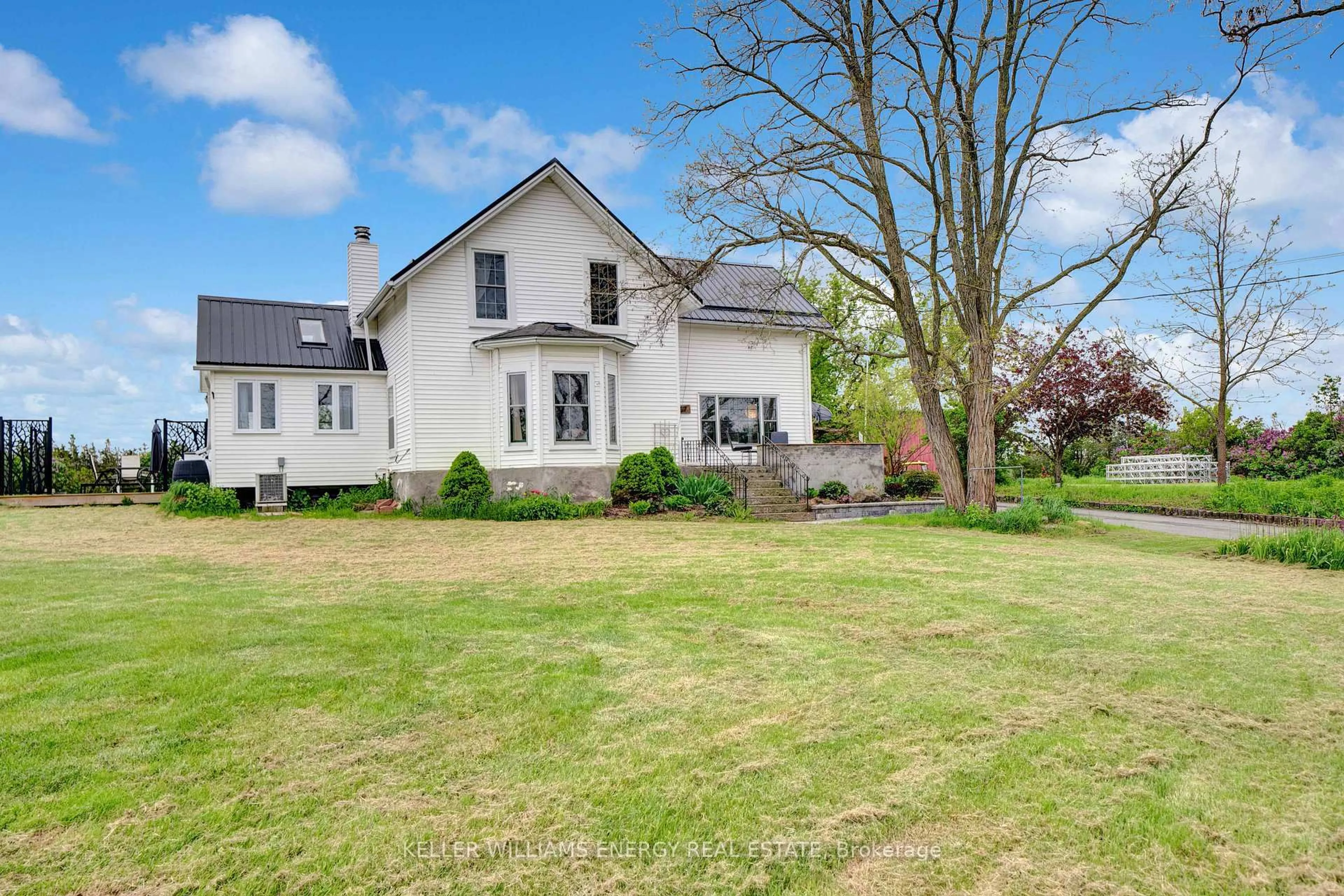 A pic from outside/outdoor area/front of a property/back of a property/a pic from drone, street for 1727 County Road 14 Rd, Prince Edward County Ontario K0K 1A0