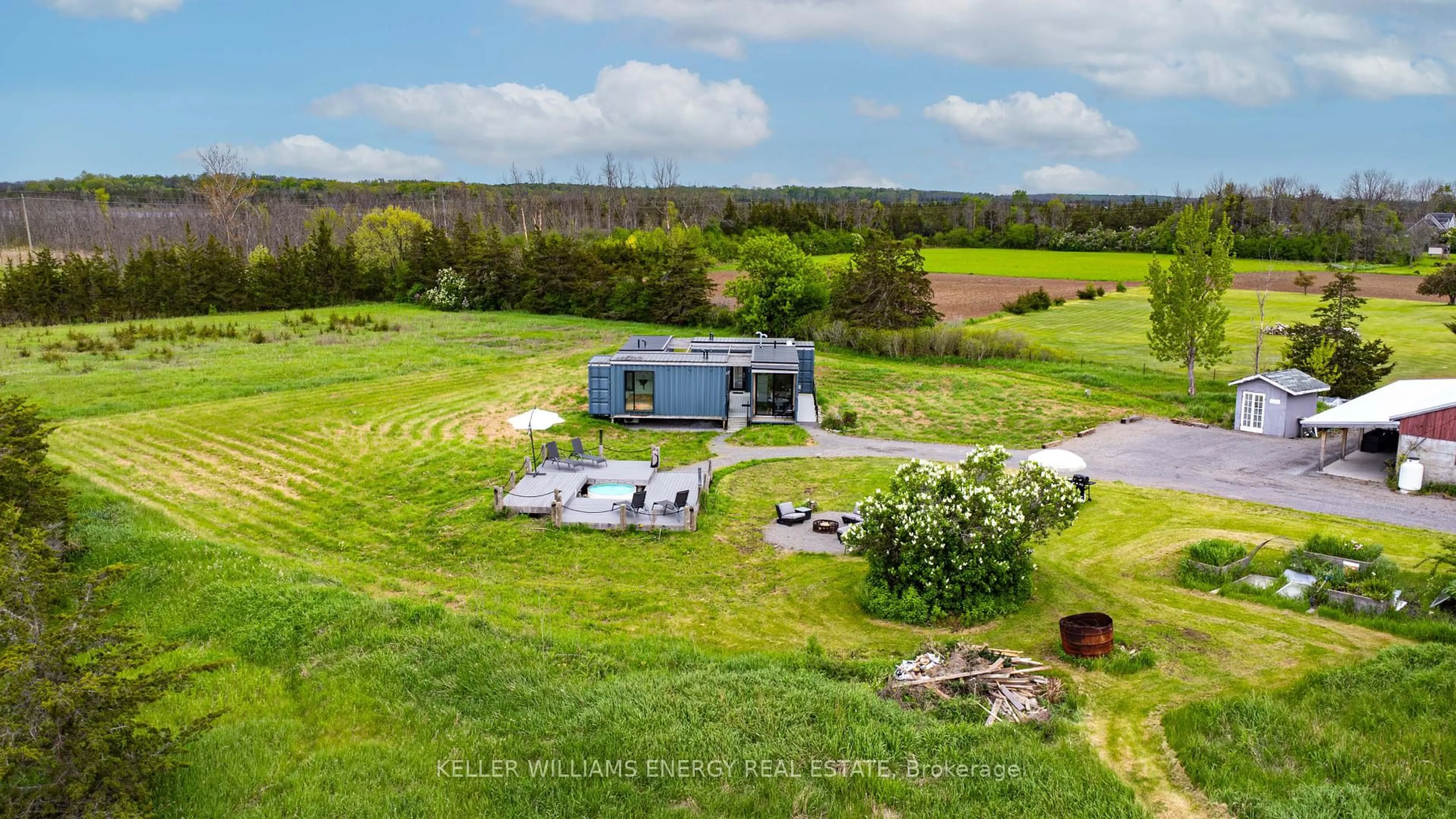 A pic from outside/outdoor area/front of a property/back of a property/a pic from drone, water/lake/river/ocean view for 1727 County Road 14 Rd, Prince Edward County Ontario K0K 1A0