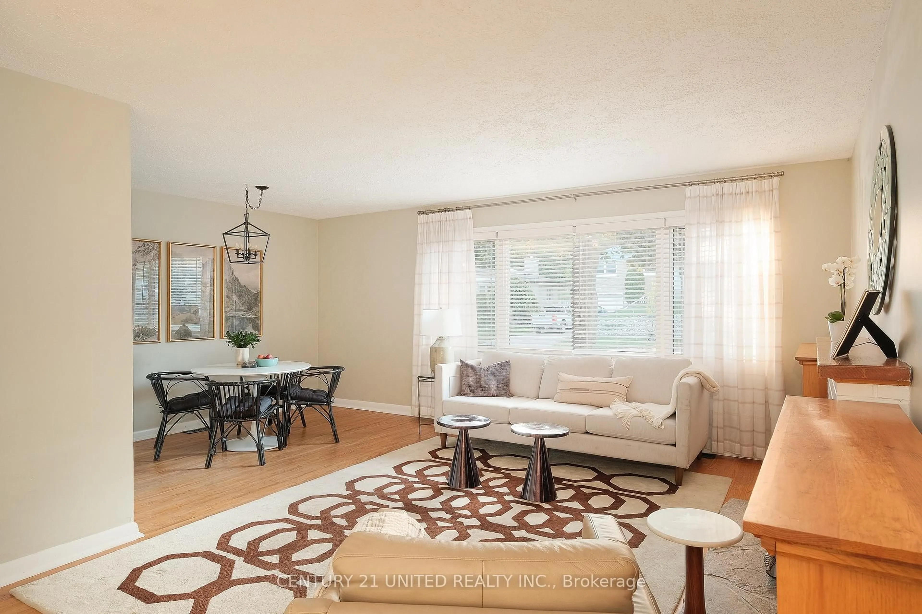 Living room with furniture, wood/laminate floor for 1518 Westbrook Dr, Peterborough Ontario K9J 7V4