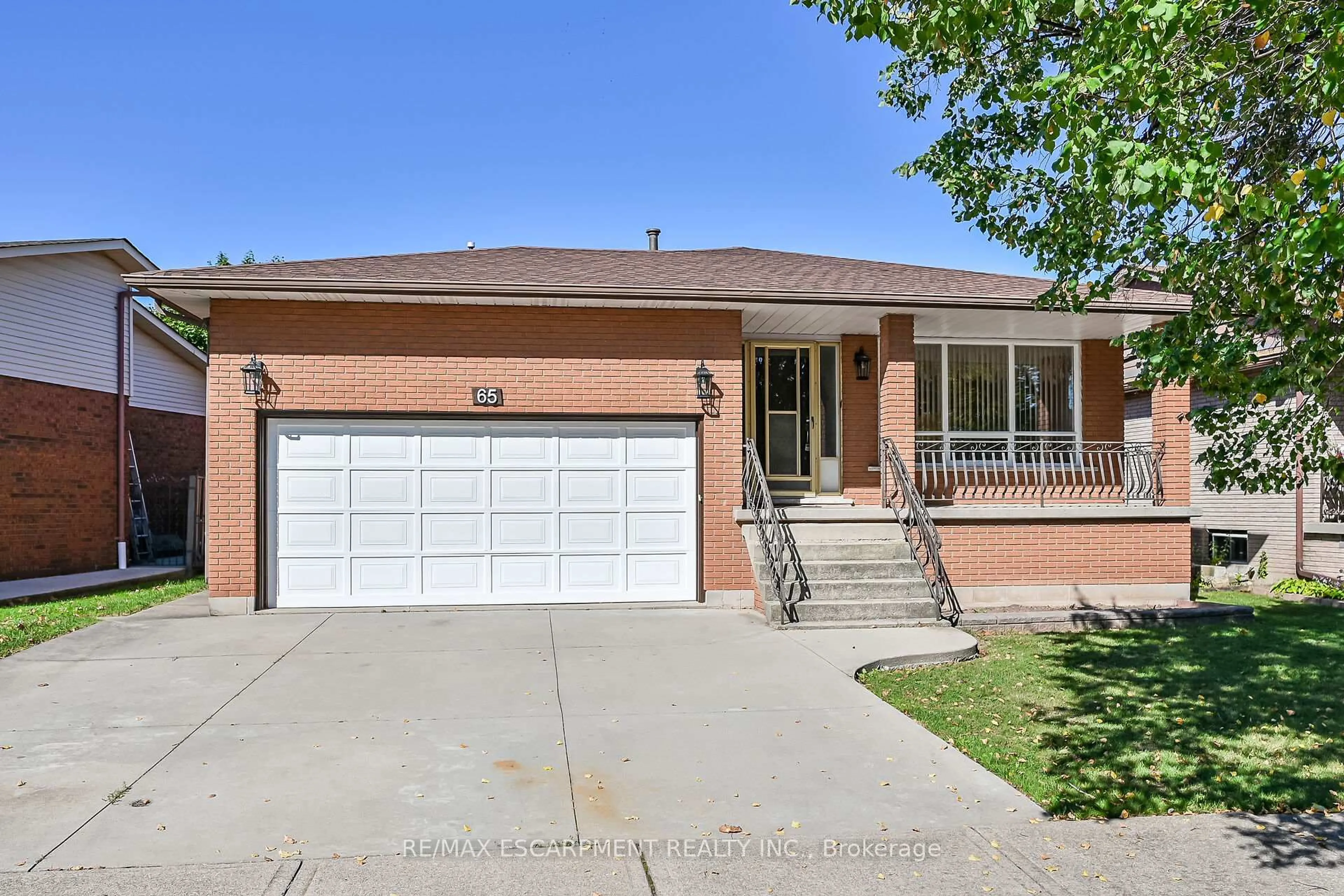 Home with brick exterior material, street for 65 Ellington Ave, Hamilton Ontario L8E 3T5