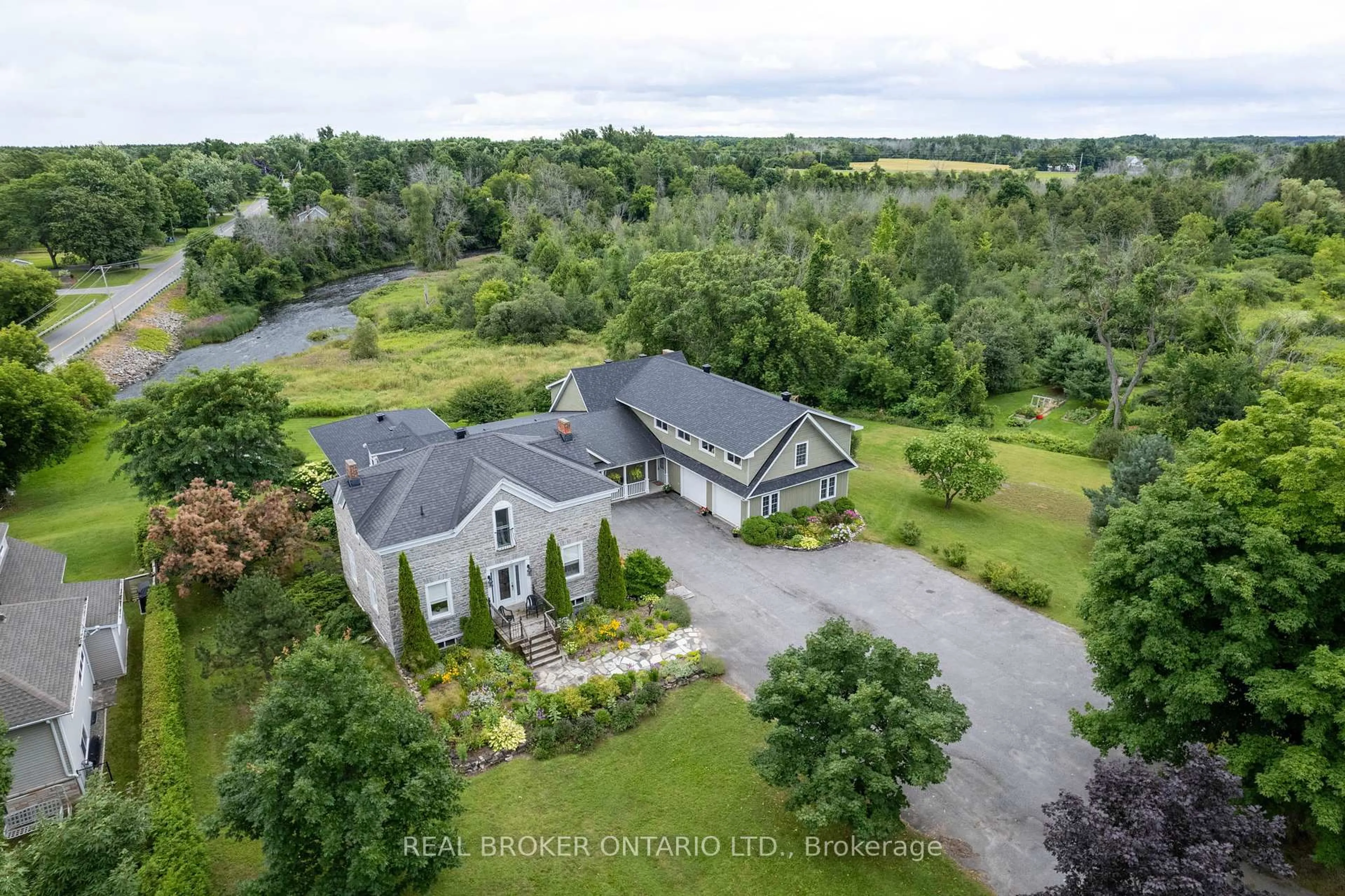 A pic from outside/outdoor area/front of a property/back of a property/a pic from drone, water/lake/river/ocean view for 2486 County Rd 18 Concession, North Grenville Ontario K0G 1J0