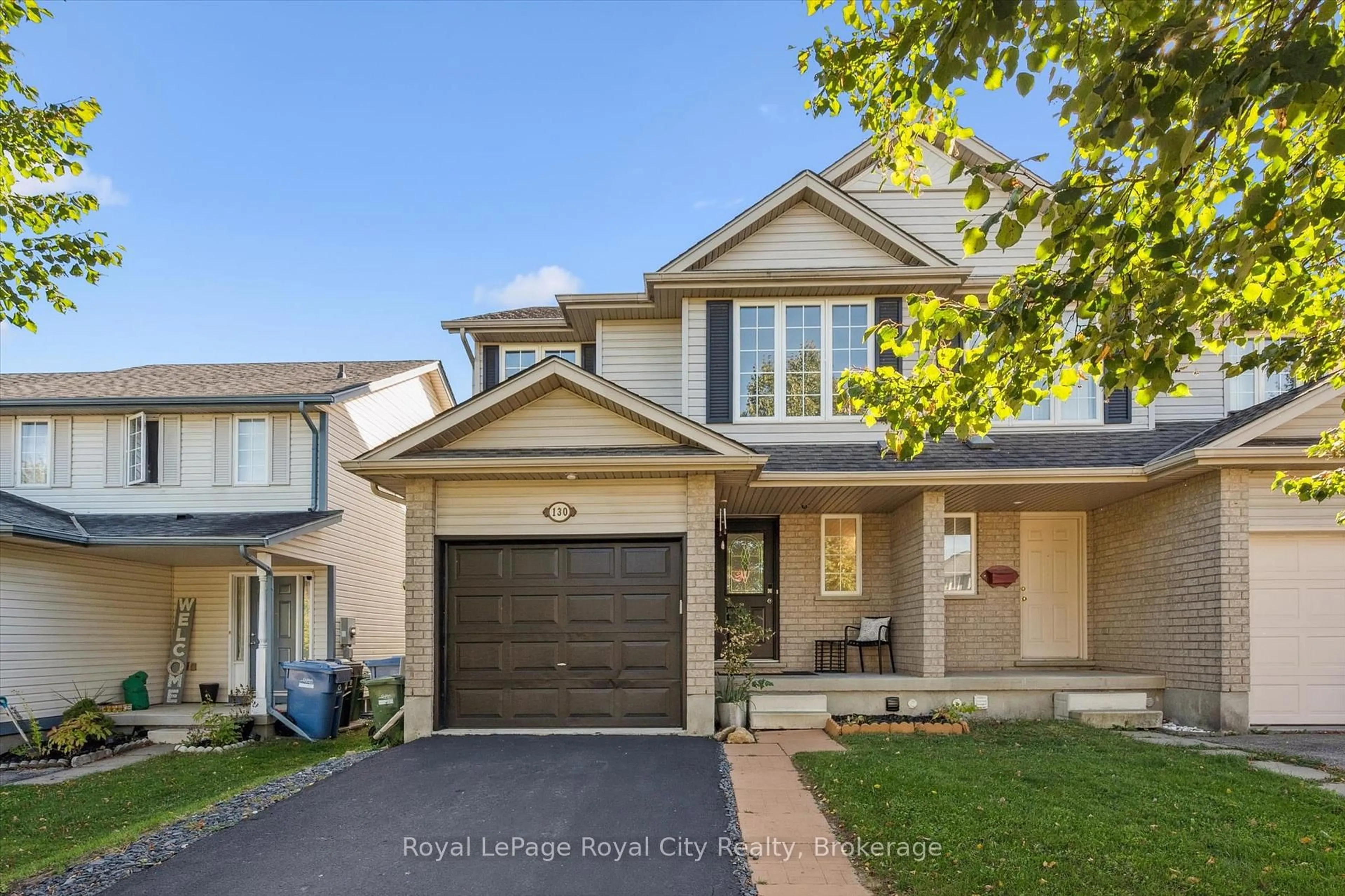 Home with vinyl exterior material, street for 130 Silurian Dr, Guelph Ontario N1E 7G1