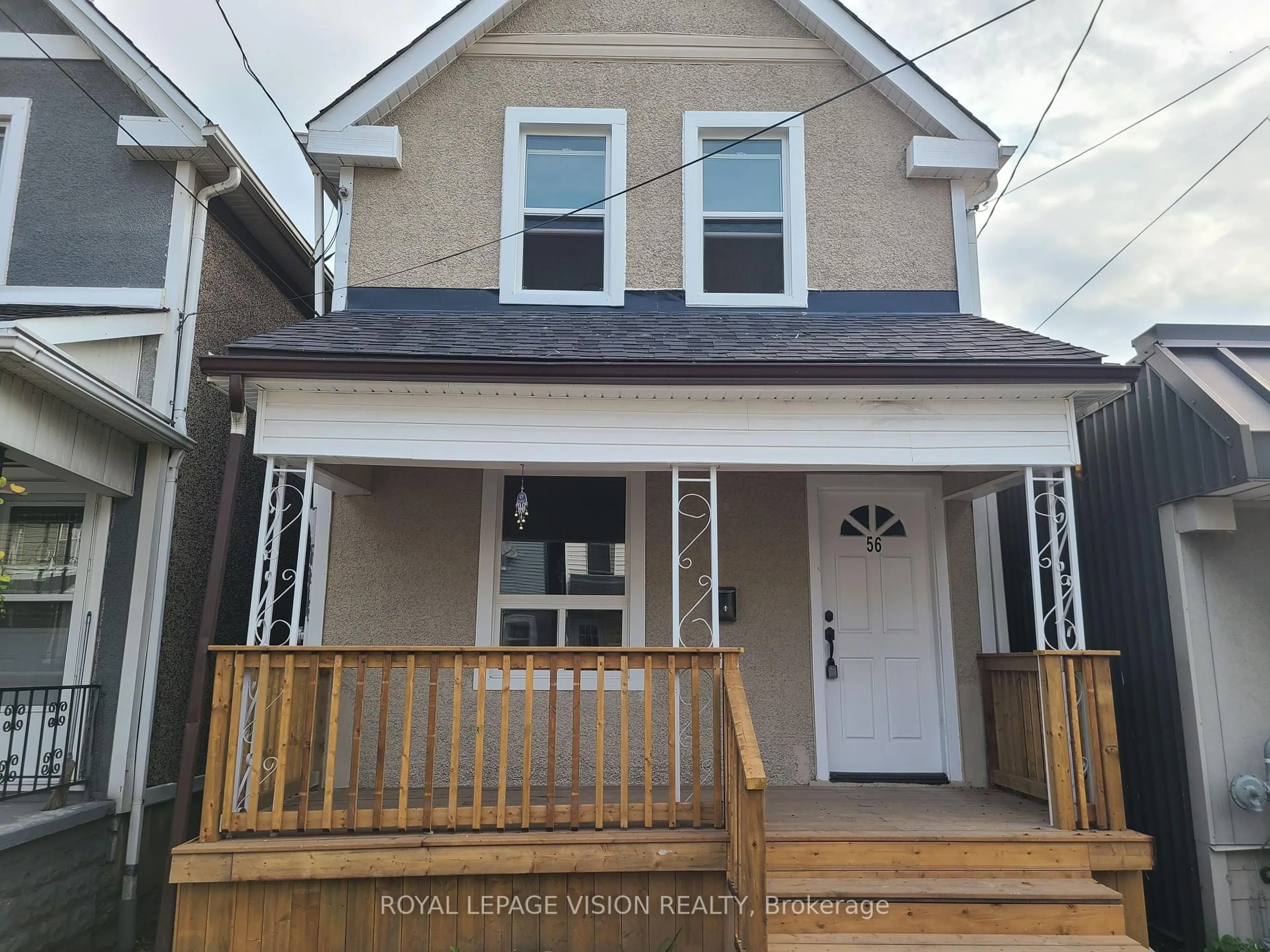 Home with vinyl exterior material, street for 56 Munroe St, Hamilton Ontario L8L 3V7