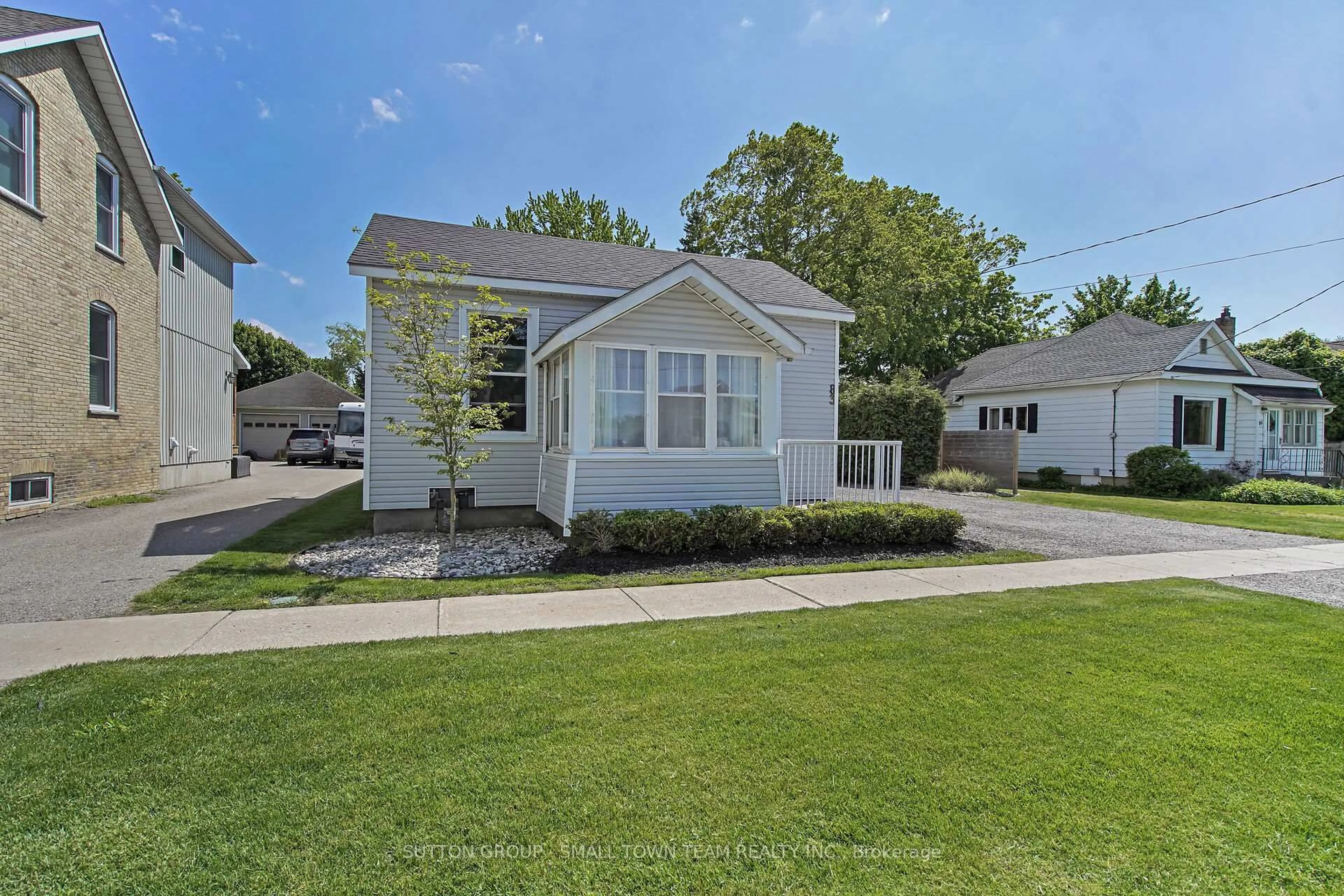 Home with vinyl exterior material, street for 83 John St, South Huron Ontario N0M 1S1