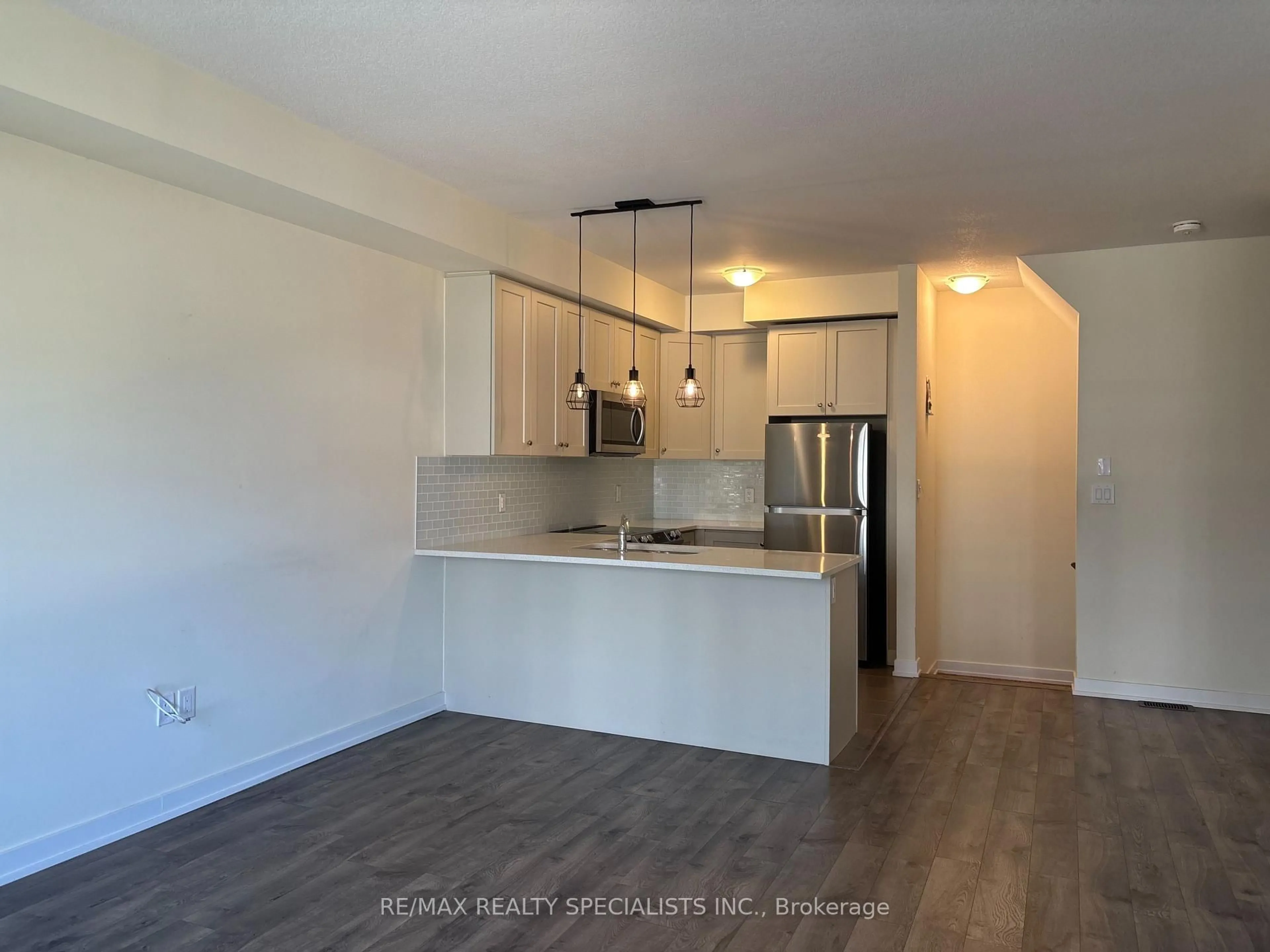 Open concept kitchen, wood/laminate floor for 590 North Service Rd #135, Hamilton Ontario L8E 0K5