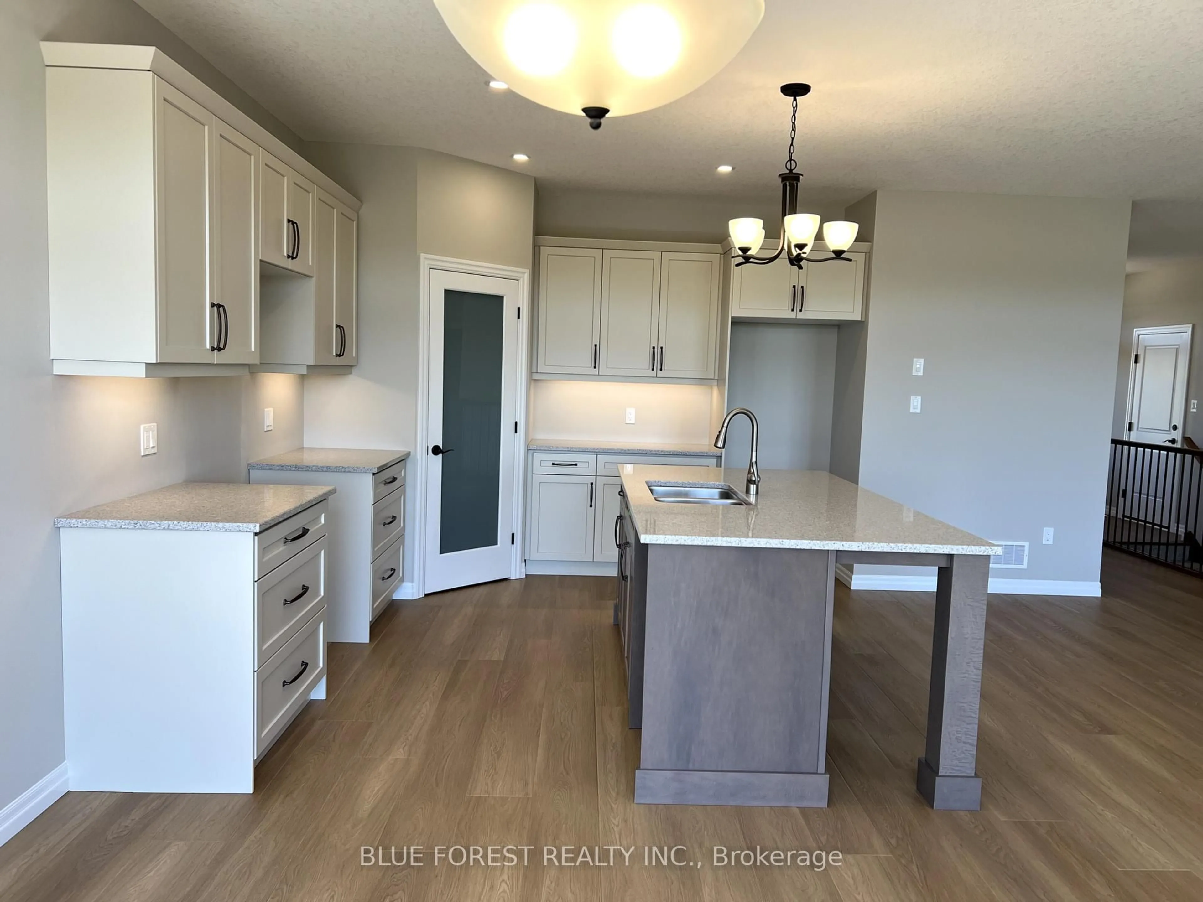 Open concept kitchen, wood/laminate floor for 218 Snyders Ave, Central Elgin Ontario N0L 1B0