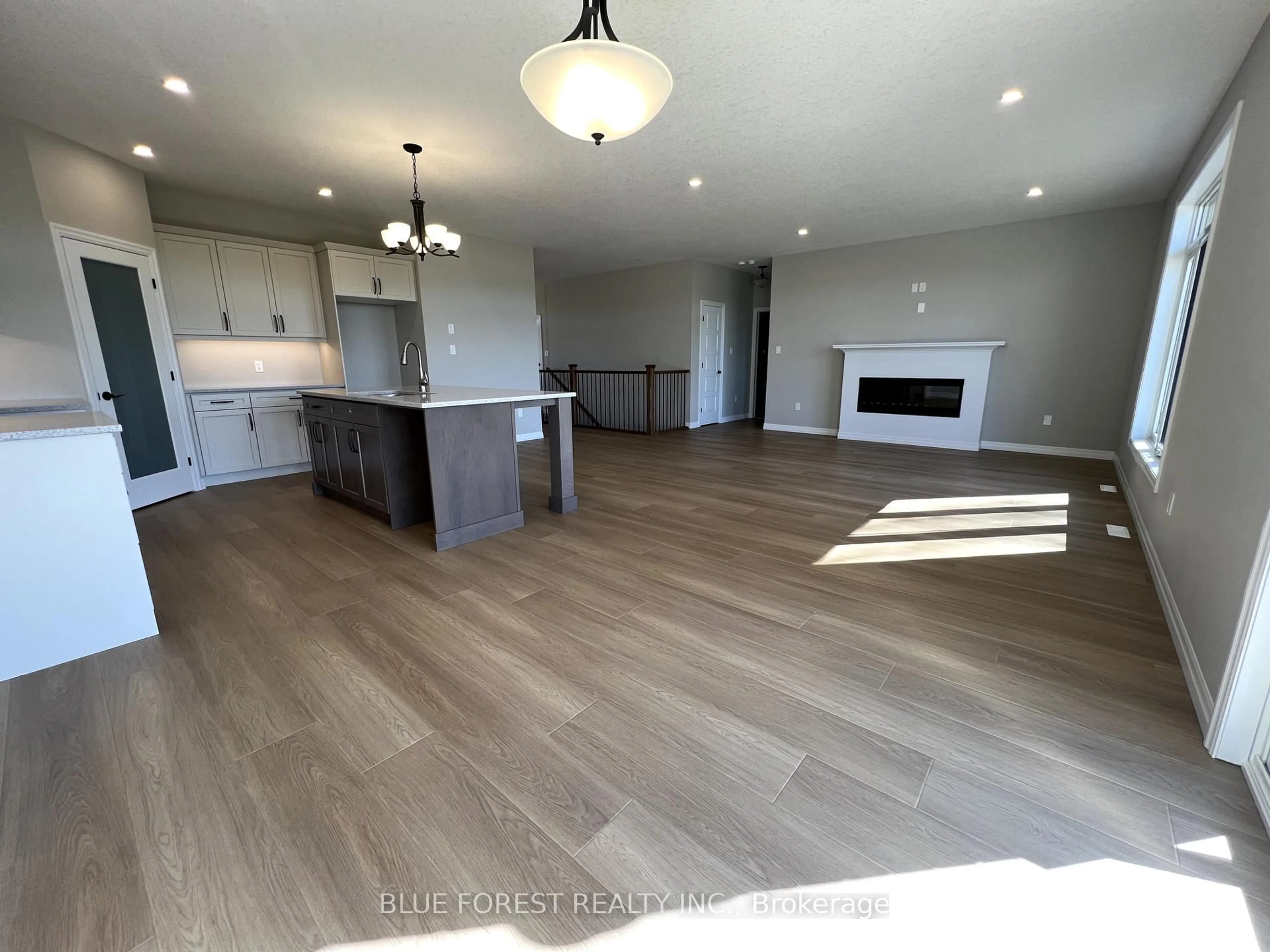 Open concept kitchen, wood/laminate floor for 218 Snyders Ave, Central Elgin Ontario N0L 1B0